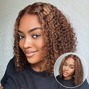 A woman with a chic brown curly bob wig featuring subtle highlights, showcasing a natural hairline and defined curls.