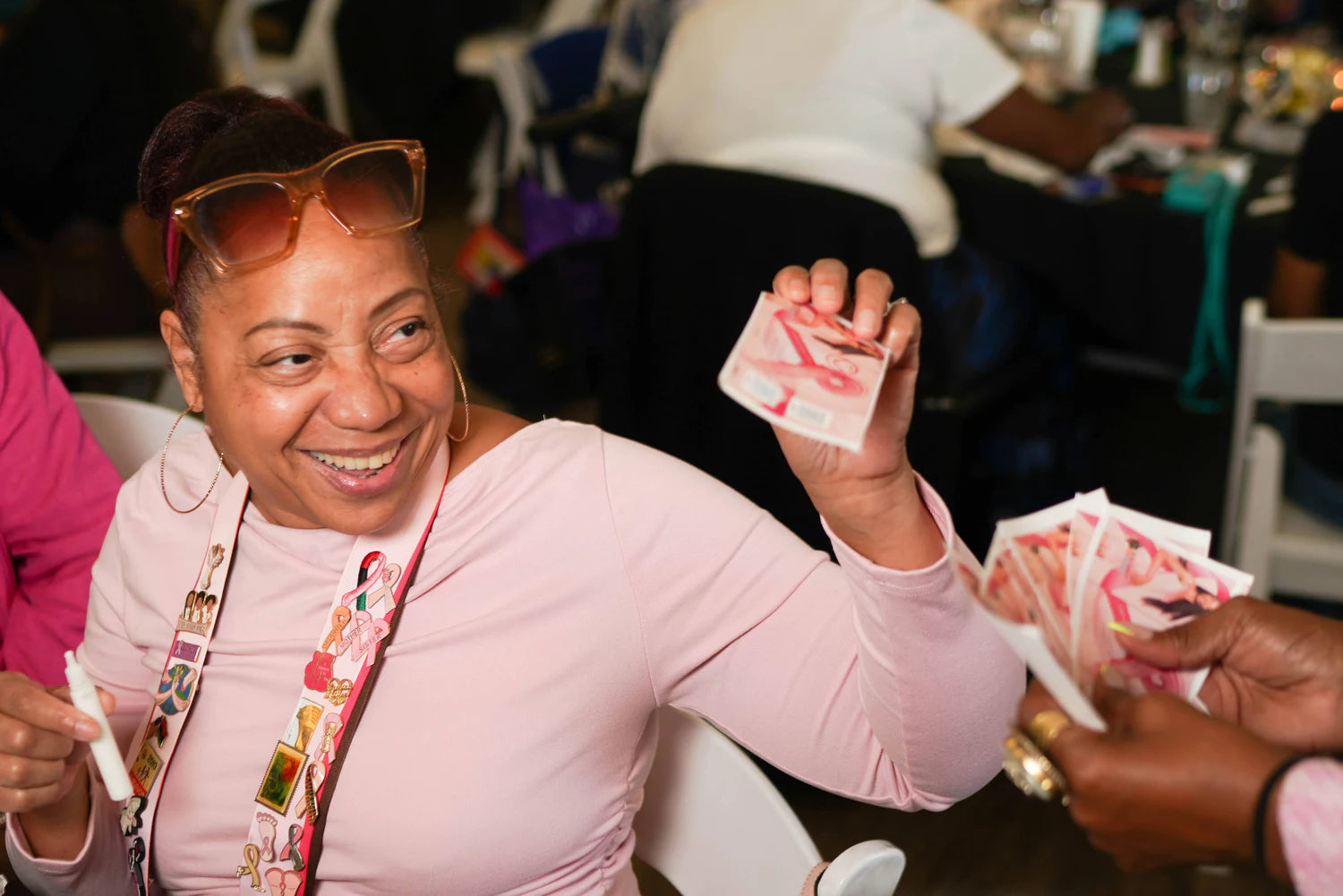A smiling woman participating in a women’s health event