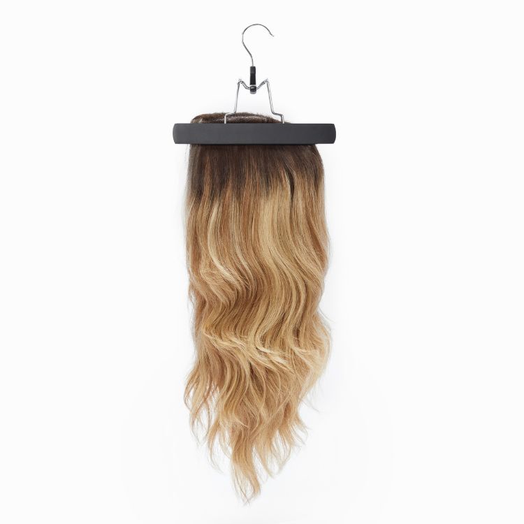 Two portable Luvme Hair wig storage bags with transparent zip closures and anti-slip wooden hangers for secure hair extension storage.