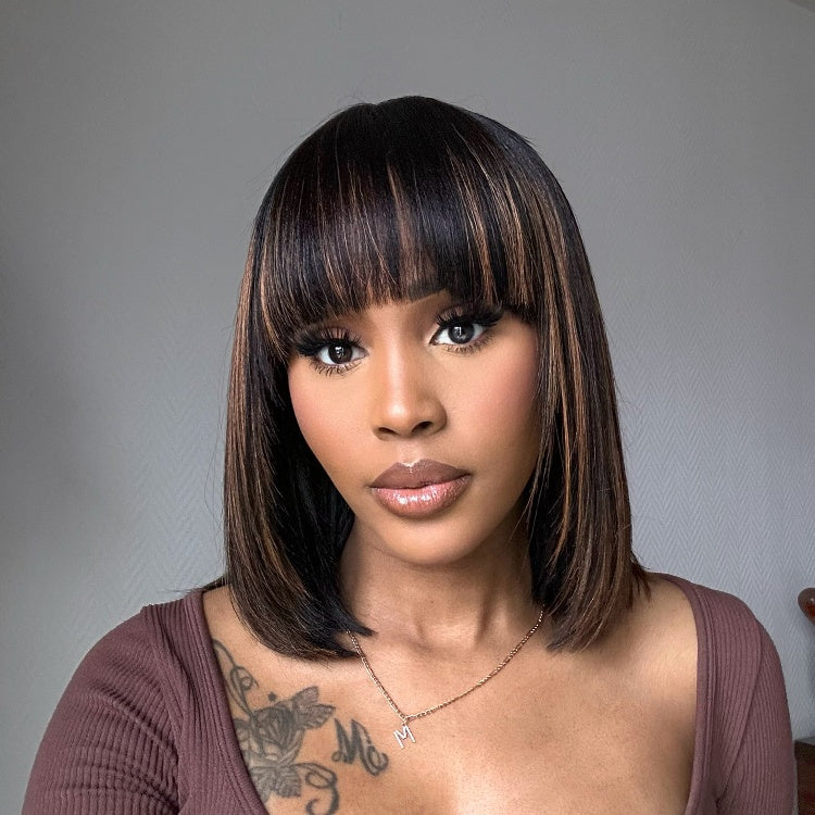 Luvme layered Yaki straight lace bob wig with bangs in natural black and brown highlights, featuring a minimalist style.
