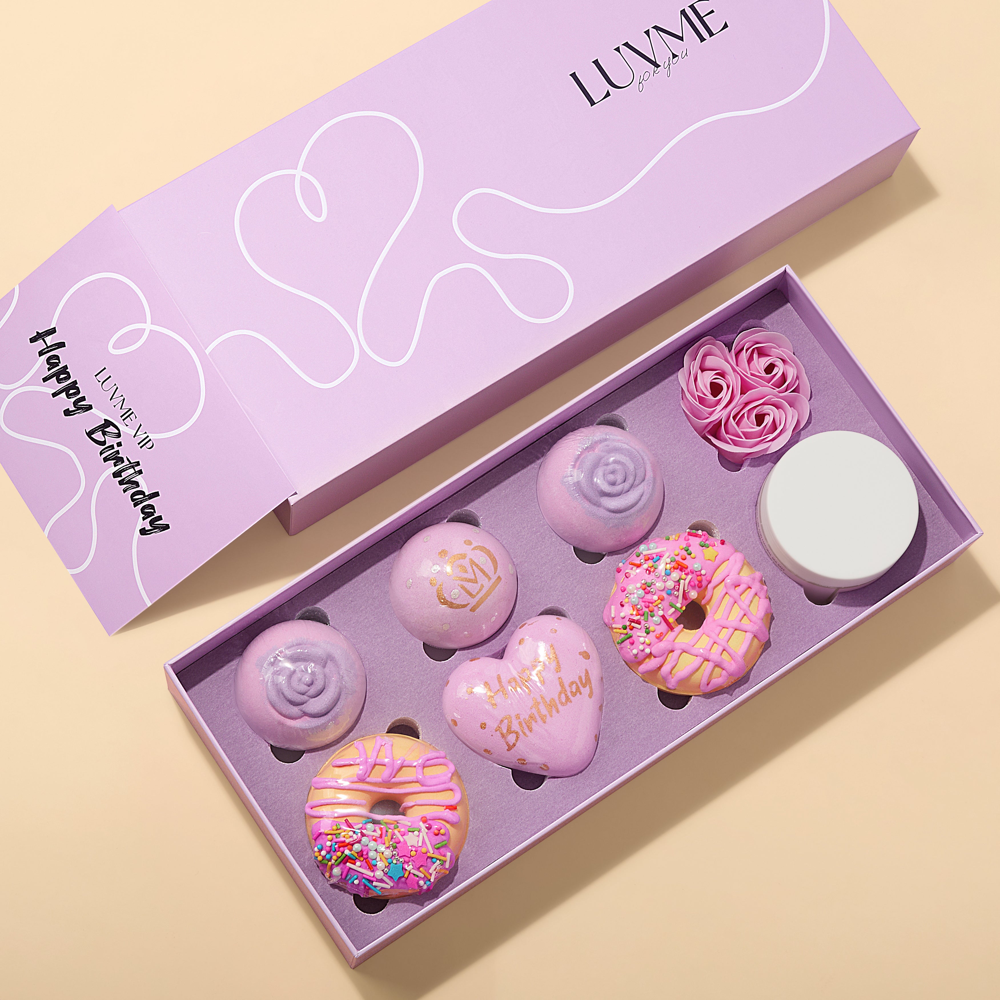 Luvme Hair VIP birthday gift set with golden queen-themed bath balls in a decorative package for special celebrations