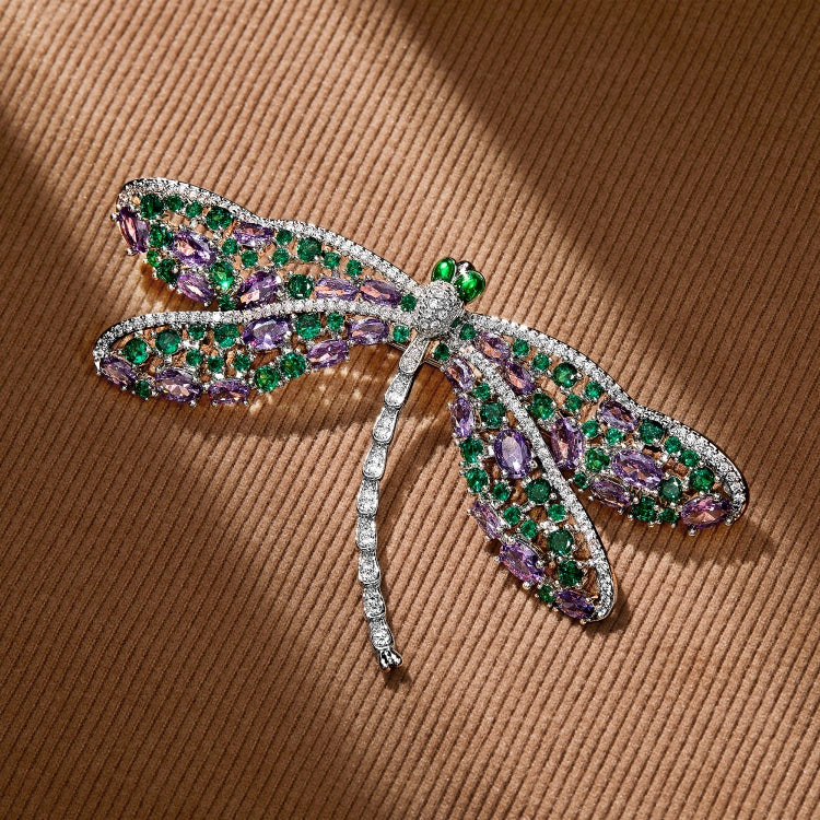 LUVME VIP Dragonfly Brooch by Luvme Hair featuring a metallic dragonfly design with intricate details and vibrant colors.