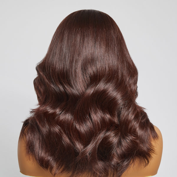 Chocolate brown layered loose body wave 4x4 lace closure wig with bangs, 100% human hair, styled for a natural look.