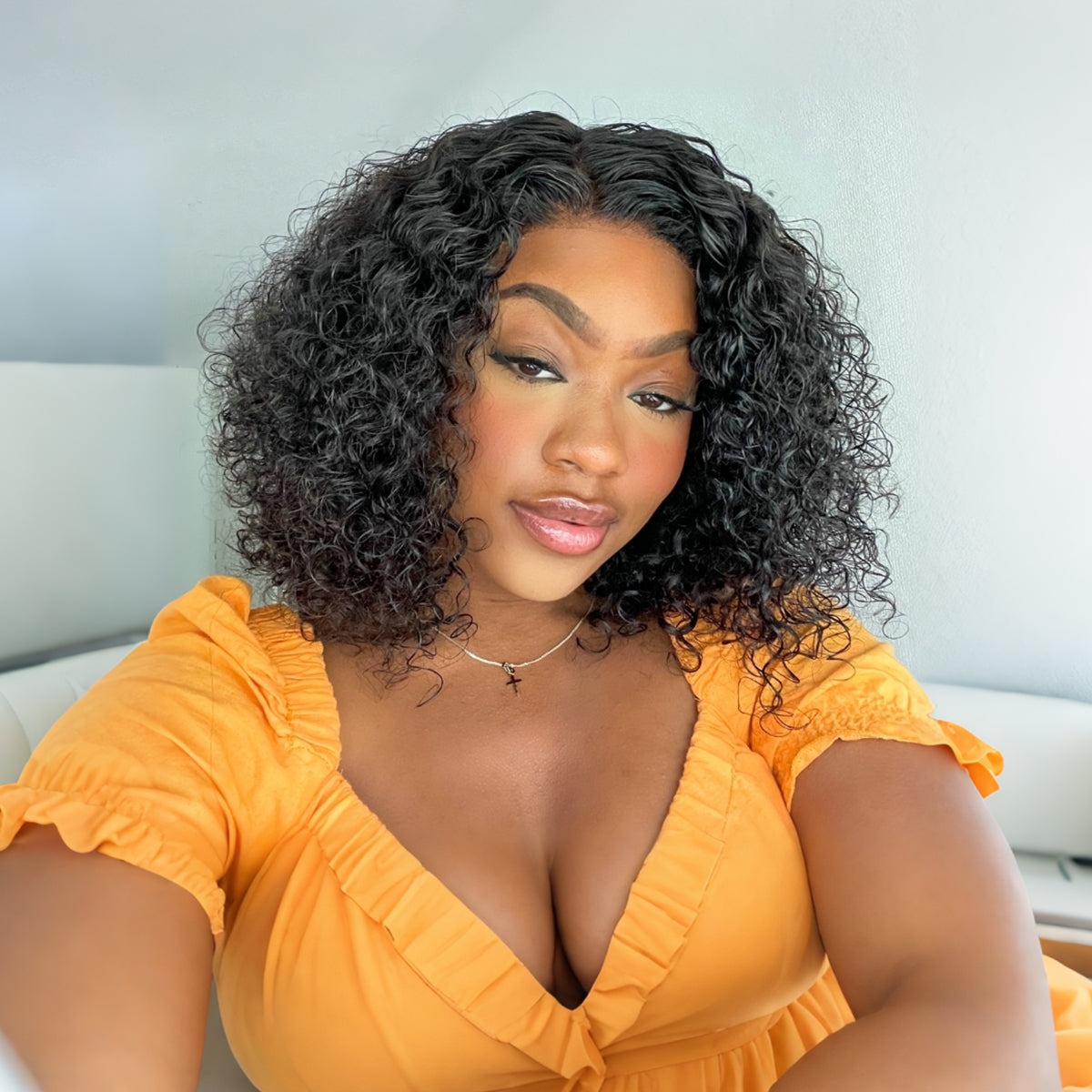 Luvme 10-inch brown ombre loose wave HD lace wig and 12-inch wet and wavy water wave 4x4 closure lace wig on a mannequin.
