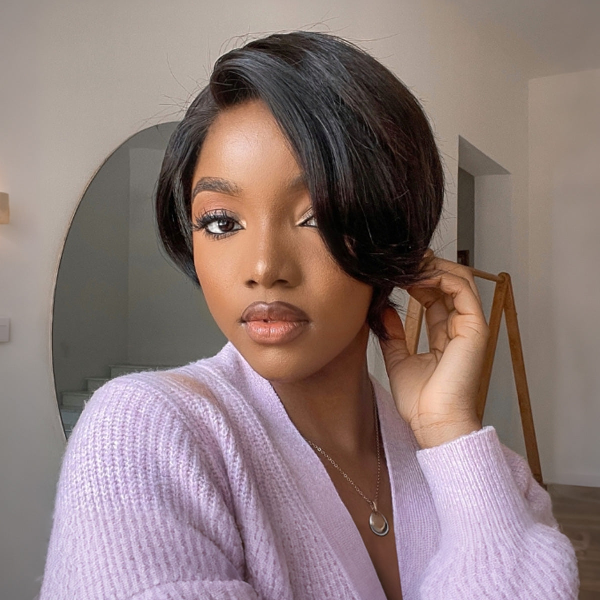 Luvme natural black pixie cut wig with 6-inch bouncy curls, bangs, 13x4 frontal, glueless style, no code needed.