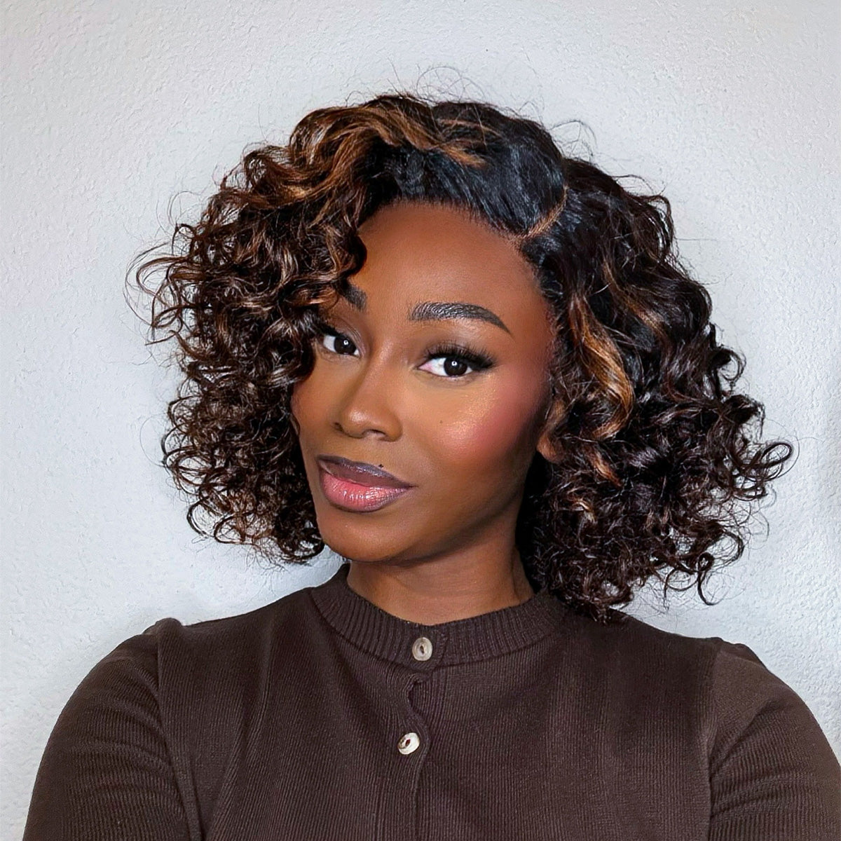 Luvme blonde highlight loose wave HD lace wig with 14-inch length and copper highlight bouncy curl 10-inch wig on a mannequin head.