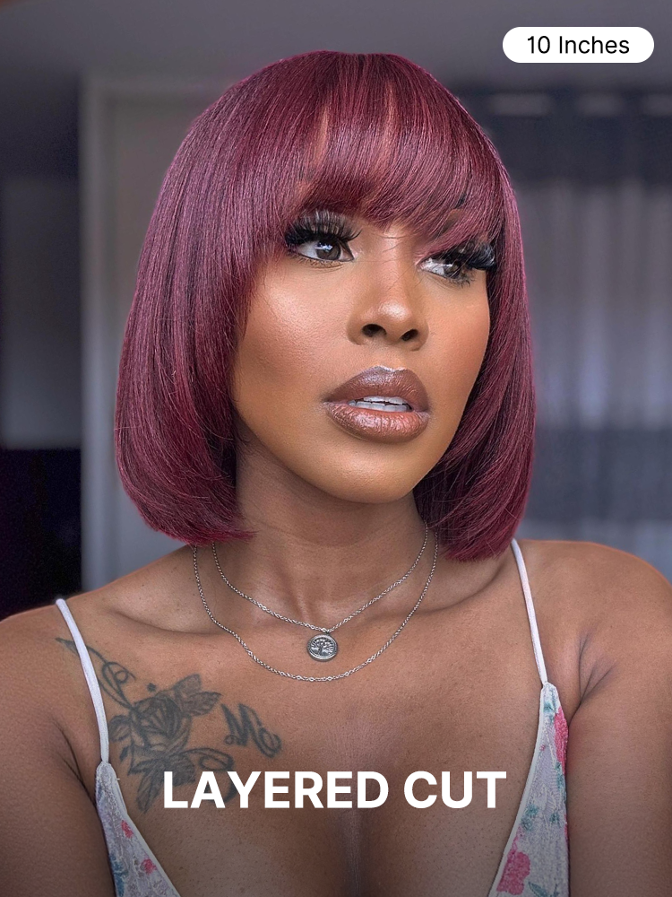 Reddish purple realistic glueless yaki straight bob wig with bangs, minimalist lace cap, by Luvme, shown on a mannequin head.