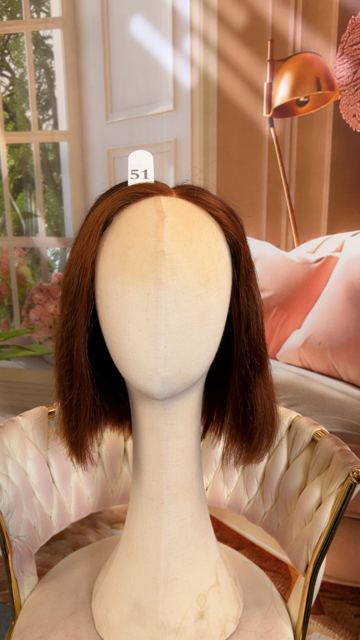 Luvme Hair live outlet wig displayed on a mannequin, showcasing a natural, full lace style with soft, flowing hair.