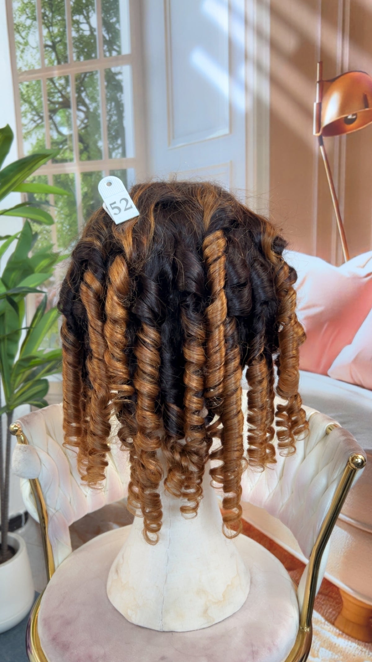Luvme Hair live outlet wig displayed on a mannequin, showcasing a stylish, full-bodied wig with natural waves and rich color.