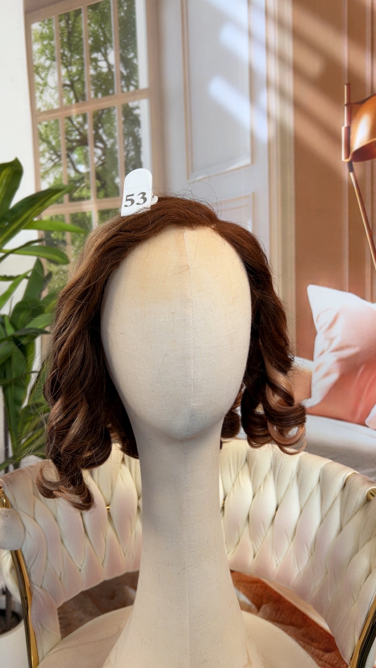 Luvme Hair live outlet wig displayed in natural black, styled with soft waves, showcasing its realistic hair texture and volume.