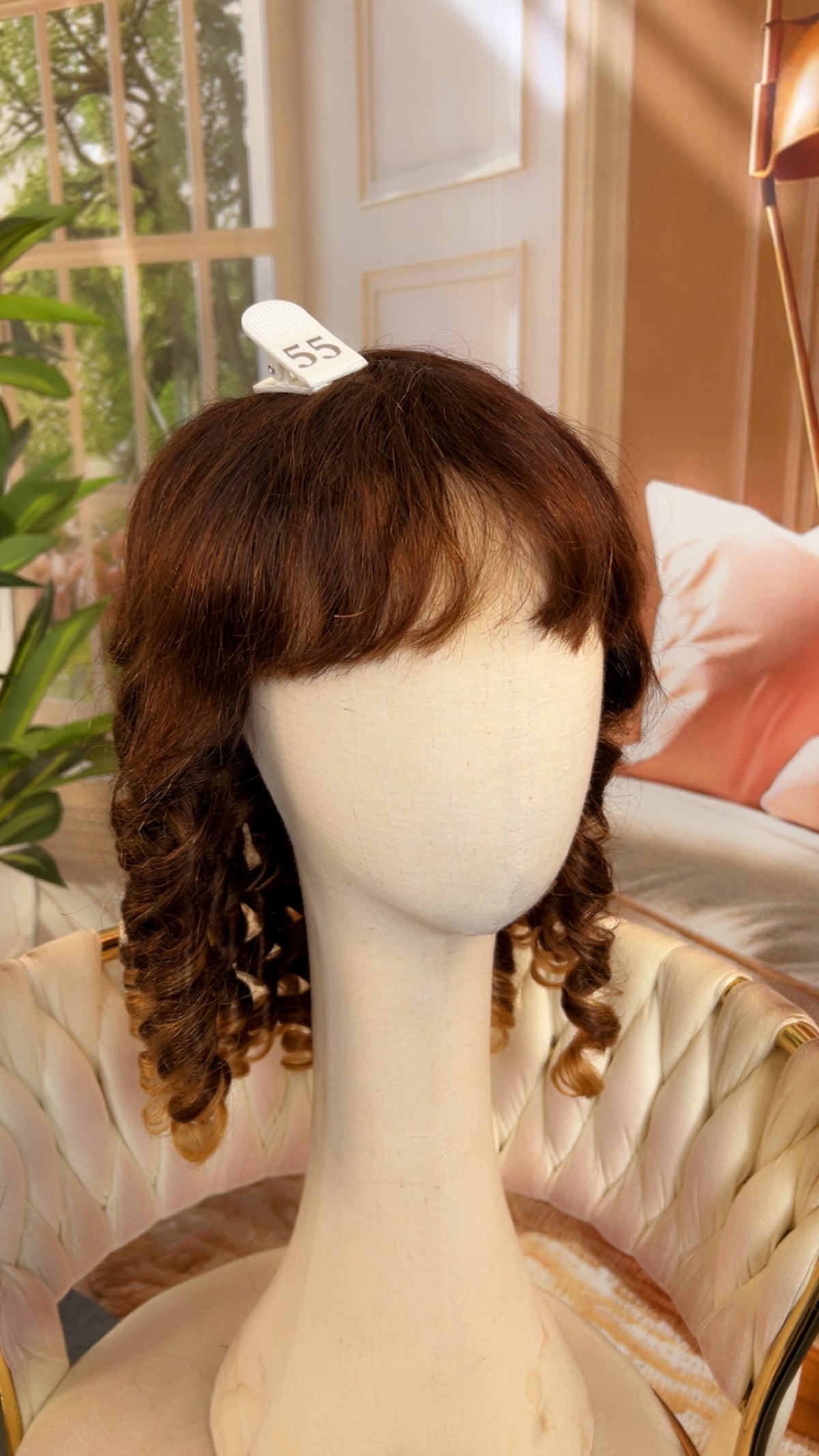 Luvme Hair outlet wig with natural black straight hair, styled with a middle part and silky texture, on a plain background.