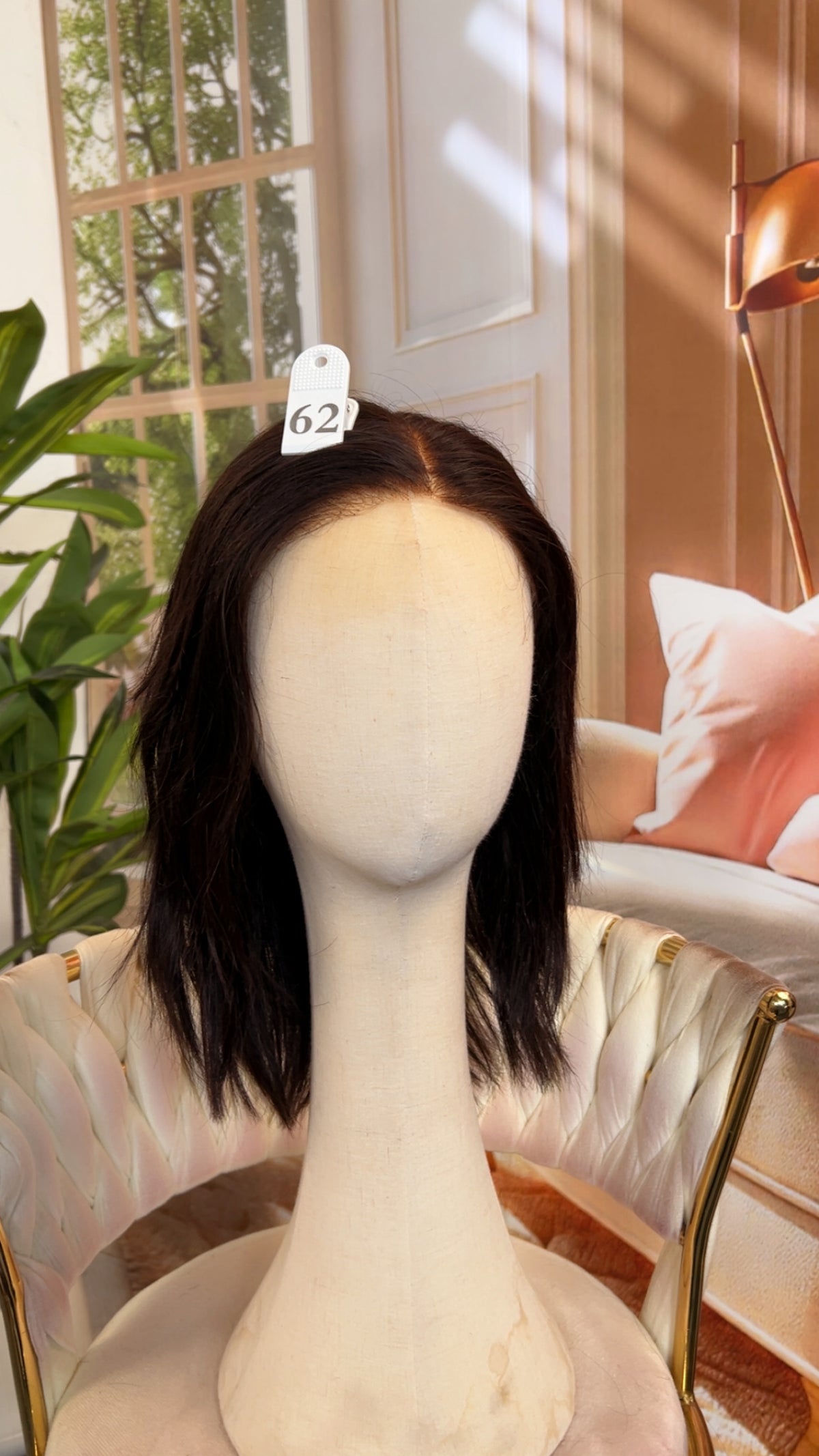 Luvme Hair outlet wig in natural black, styled with soft waves, showcasing a full lace cap for a realistic look.