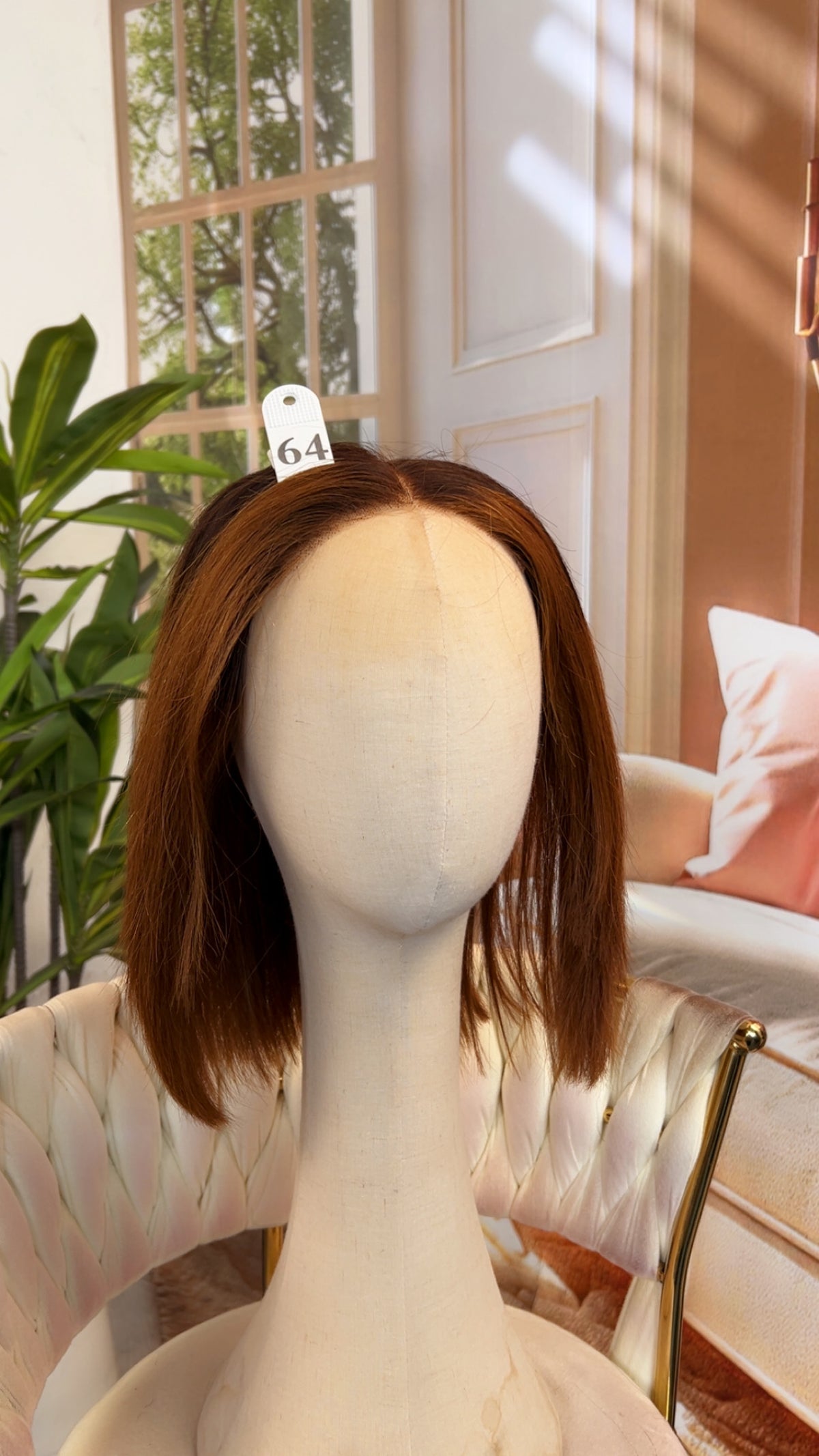 Luvme Hair outlet wig displayed on a mannequin head, showcasing a full, natural-looking synthetic wig with layered style.
