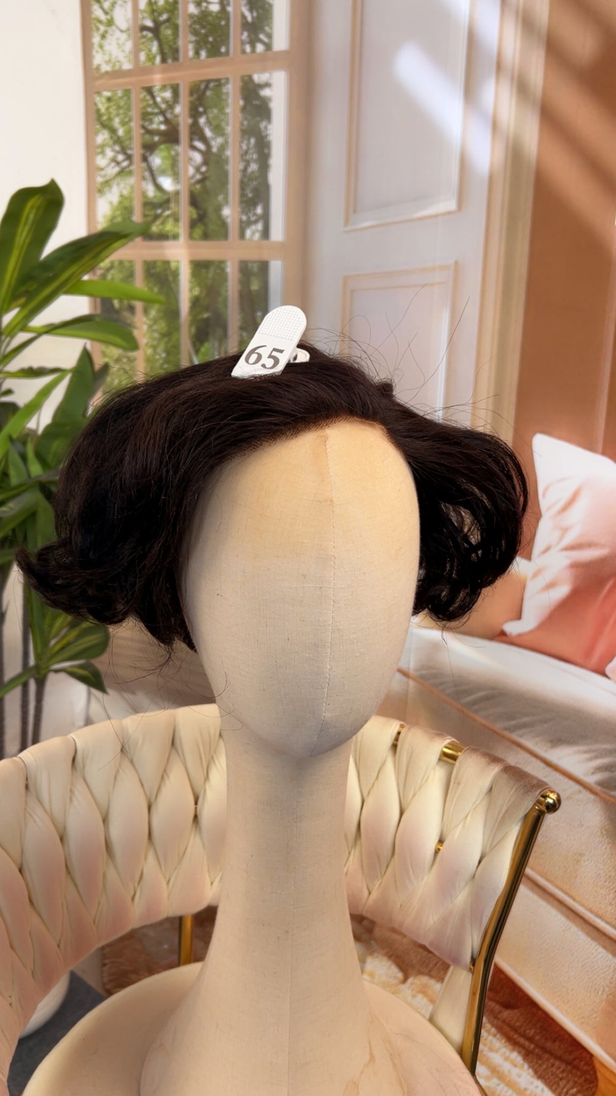 Luvme Hair outlet wig in natural black, styled with layered waves, showcasing the realistic hair texture and full length.