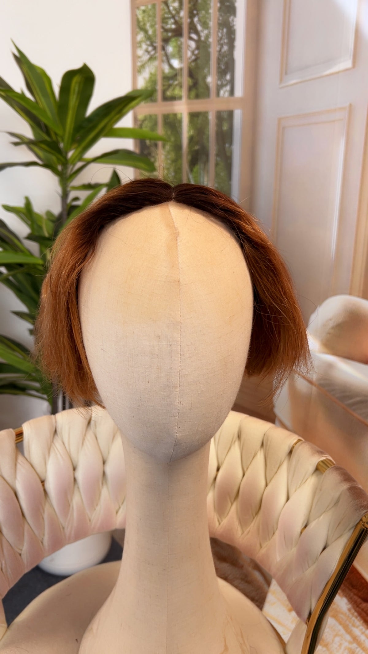 Luvme Hair outlet wig in natural black, styled with loose waves, showcasing a full lace cap and realistic hair texture.