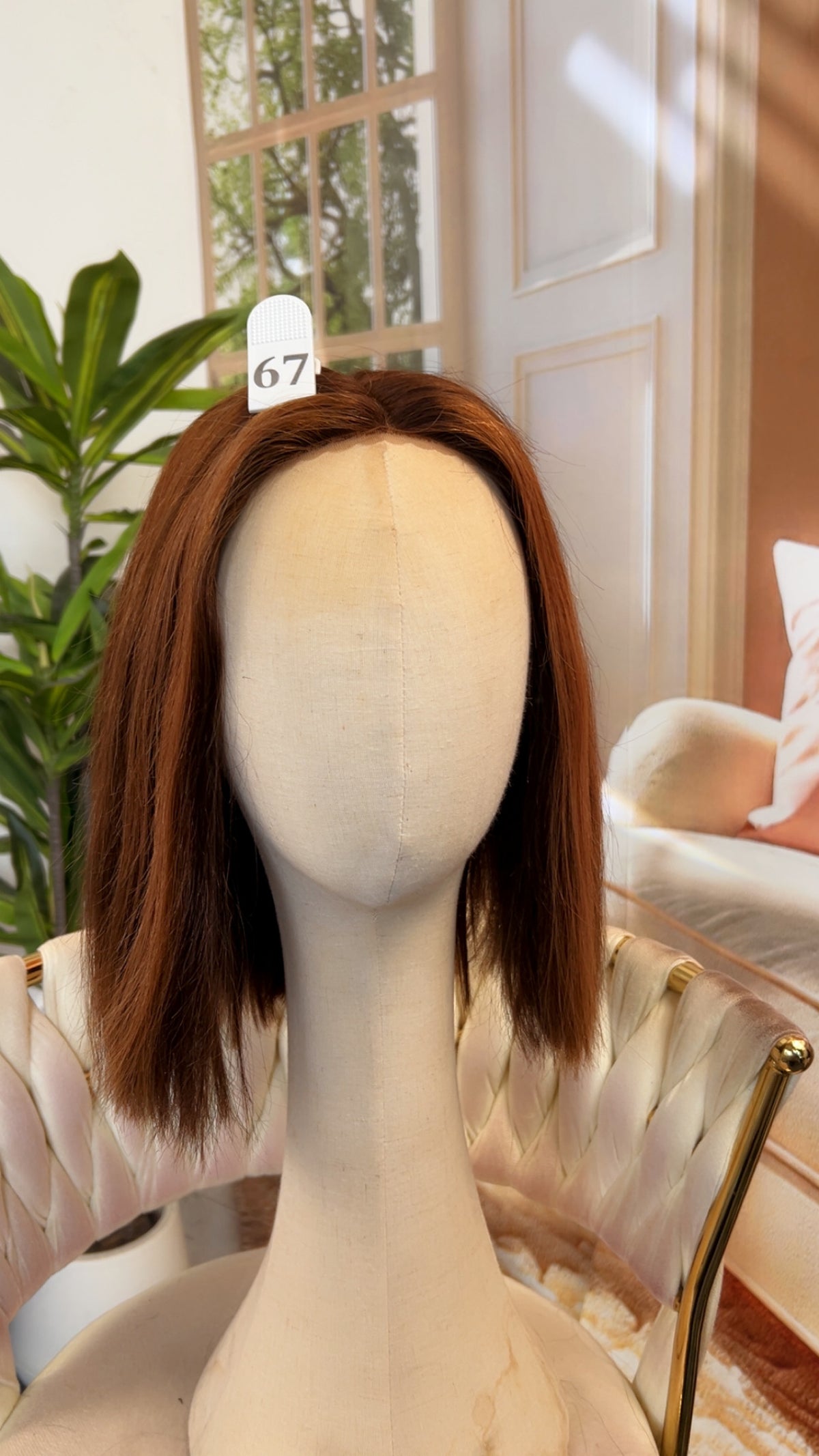 Luvme Hair live outlet wig displayed on a mannequin head, showcasing the style and texture of the synthetic wig.