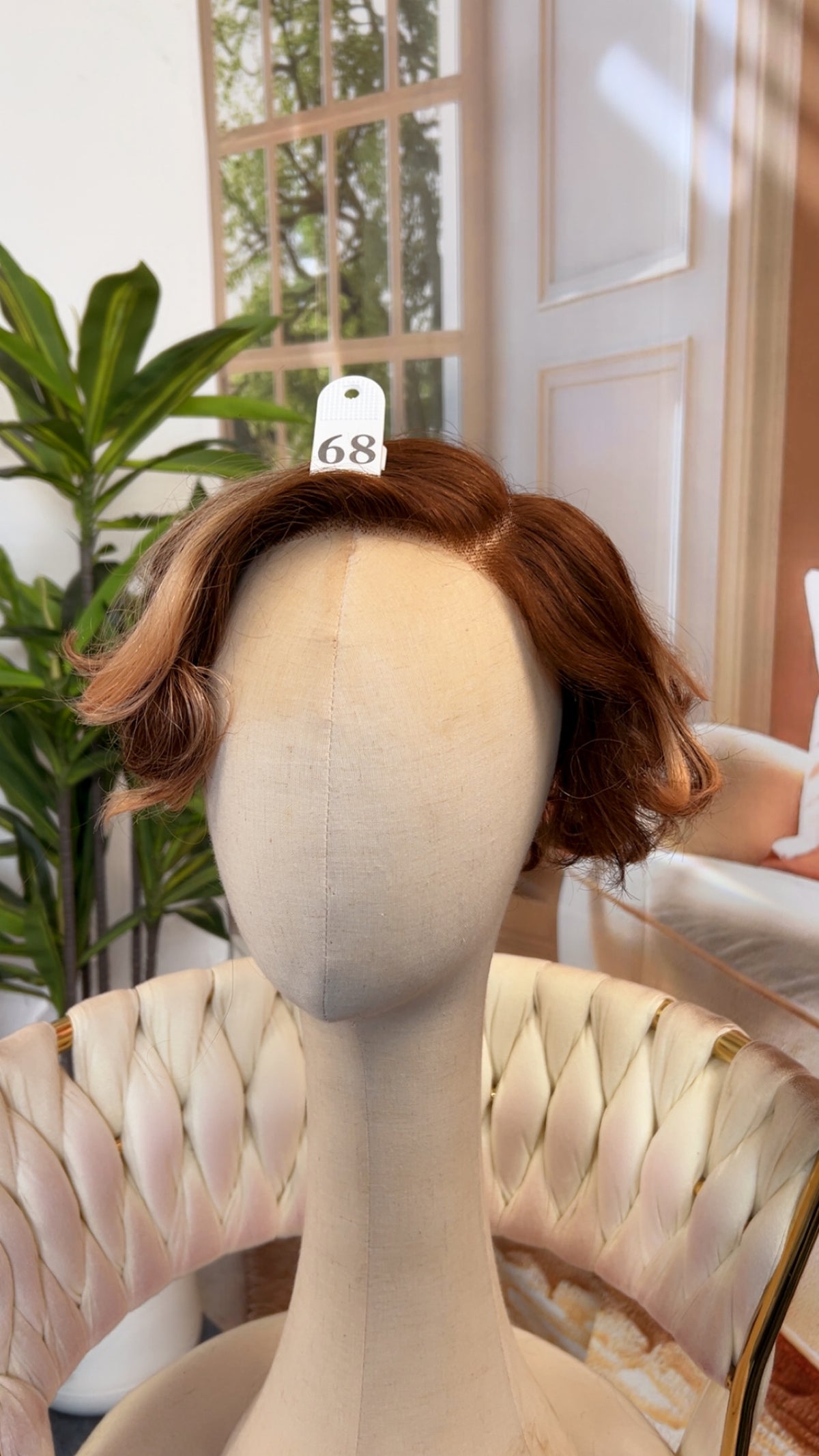 Luvme Hair outlet wig displayed on a mannequin head, showcasing a natural-looking, styled wig with dark hair color and layered cut