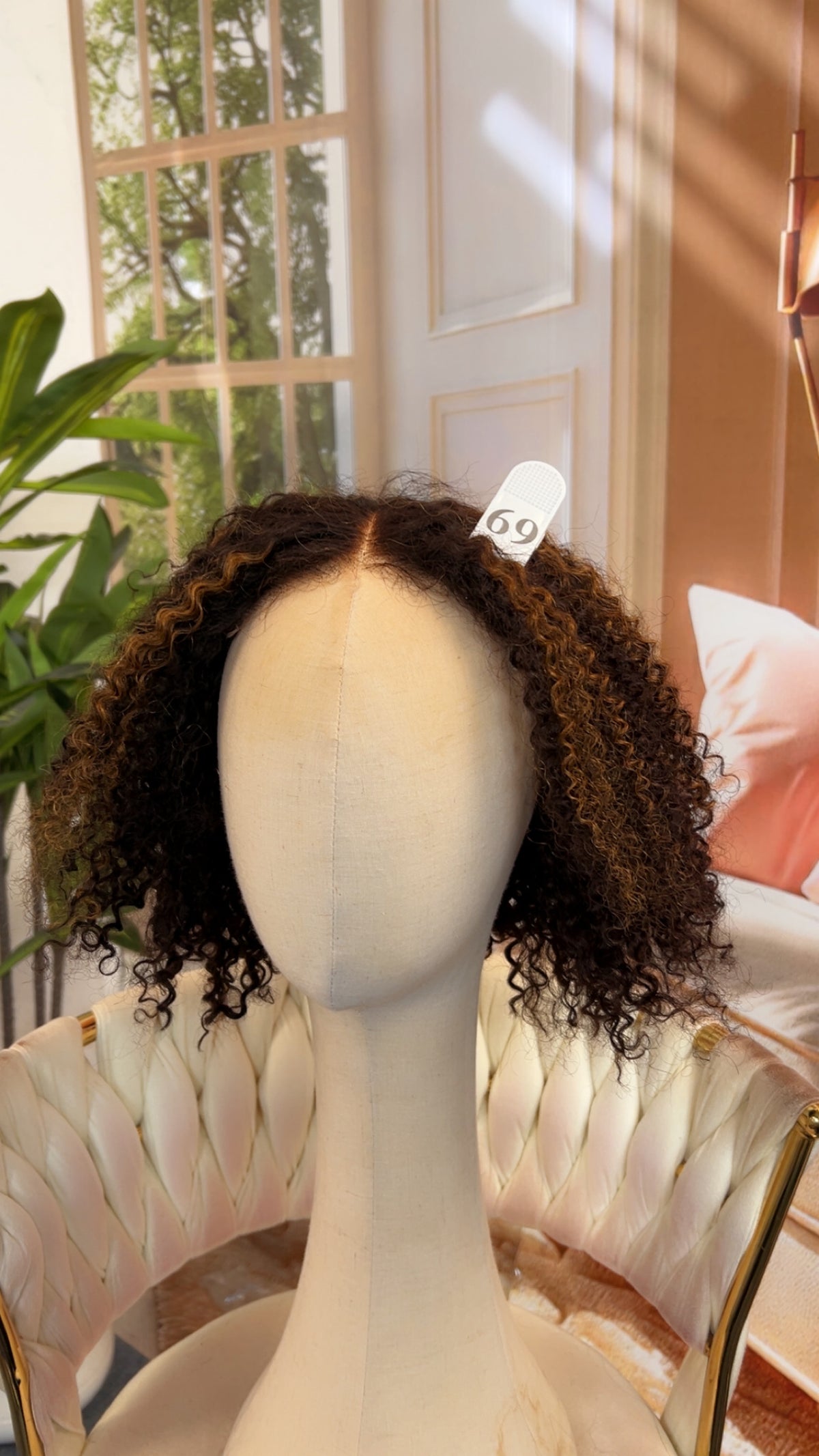Luvme Hair live outlet wig with layered dark brown hair styled in loose waves, showcasing the natural volume and shine.