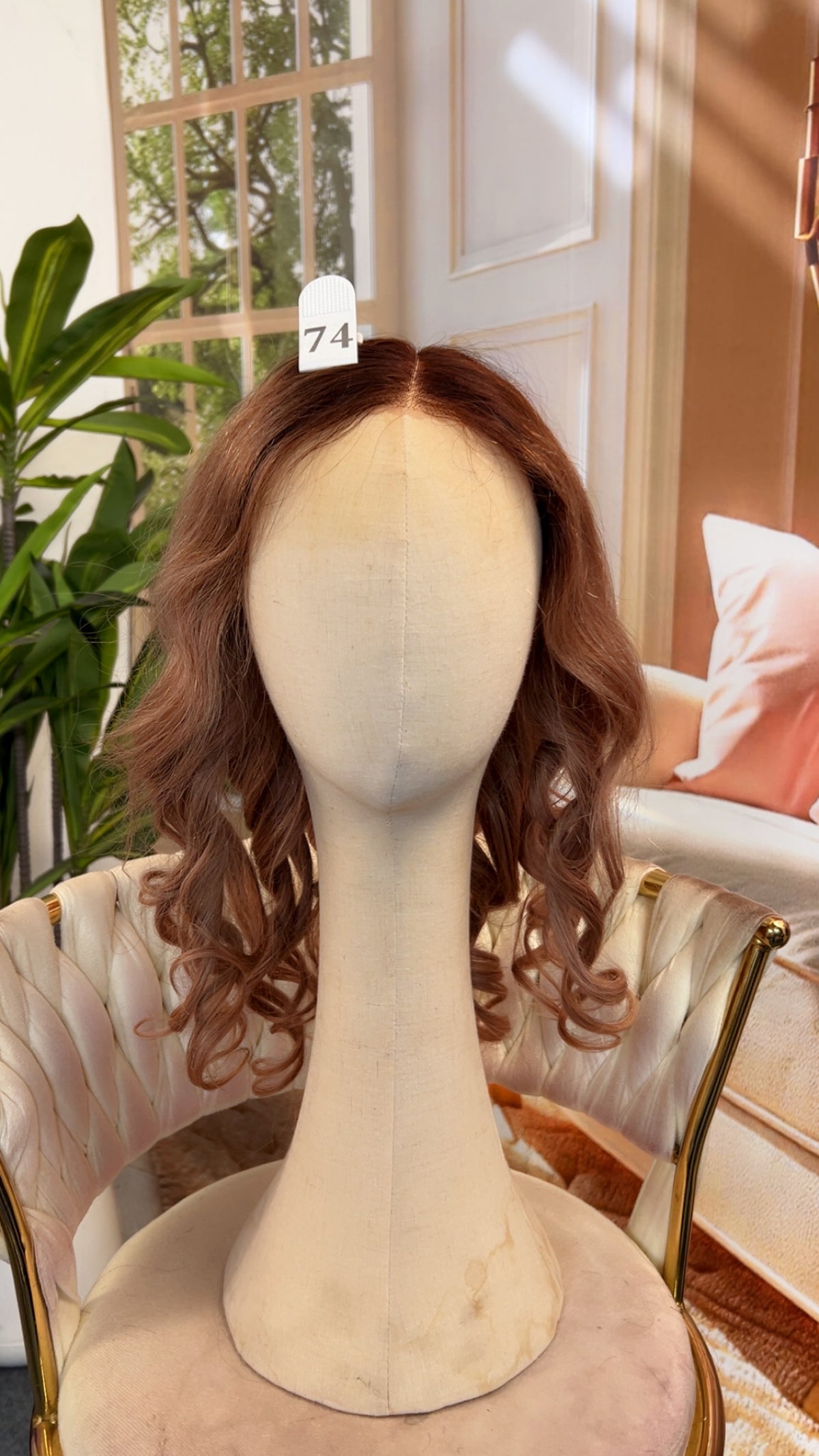 Luvme Hair live outlet wig in styled curly black with natural hairline, showcasing the full wig cap and textured curls.
