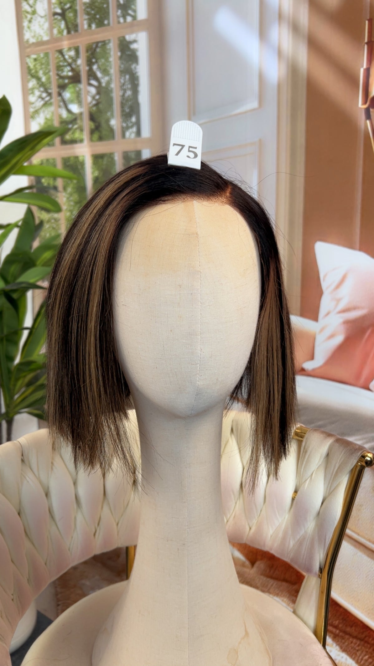Luvme Hair outlet wig featuring long, wavy black hair styled with a natural parting, displayed on a mannequin head.