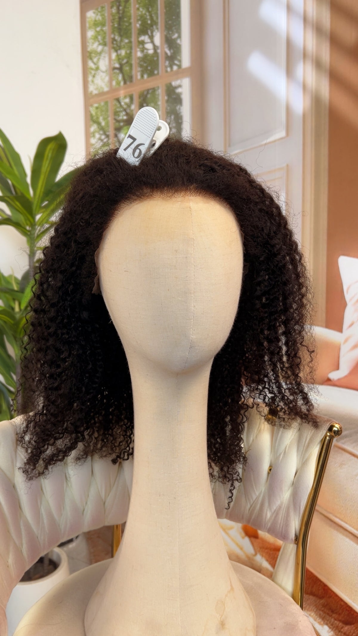 Luvme Hair live outlet wig in natural black, styled with loose waves, showcasing the high-quality synthetic fiber and realistic appearance.
