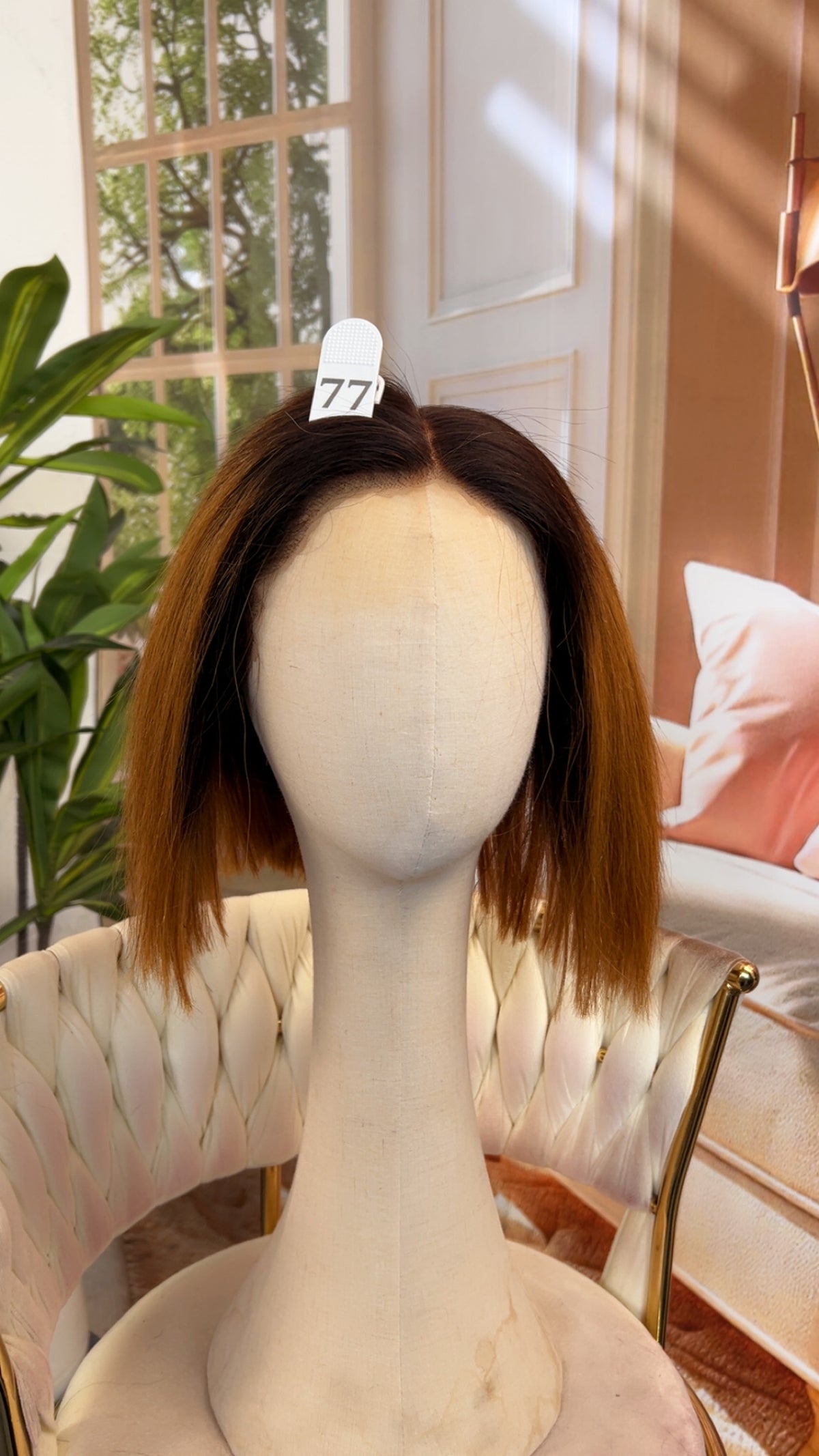 Luvme Hair live outlet wig displayed on a mannequin, showcasing a stylish, natural-looking lace front wig in a vibrant color.