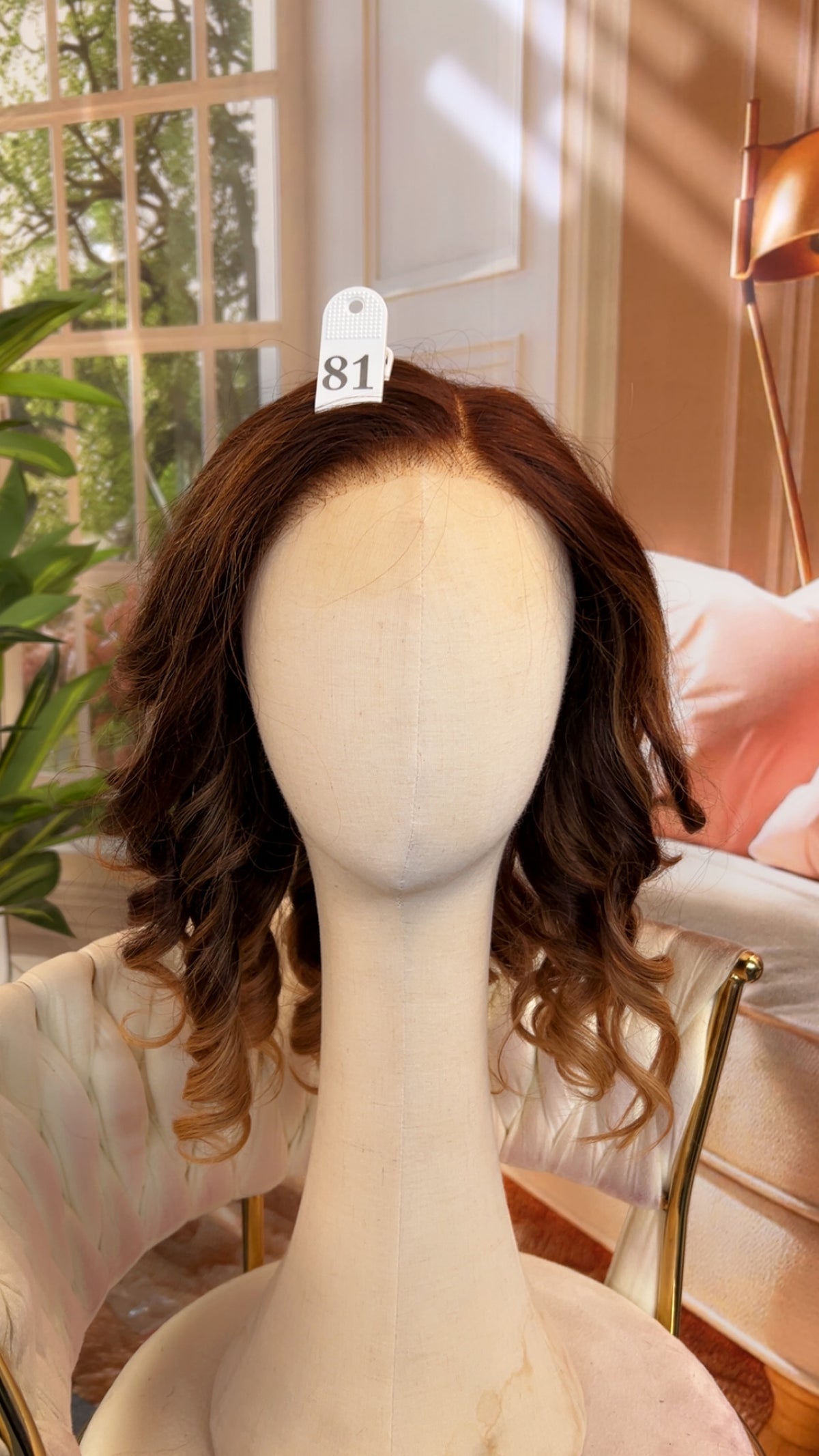 Luvme Hair live outlet wig with 50% off, showcasing long, curly black synthetic wig on a mannequin head.