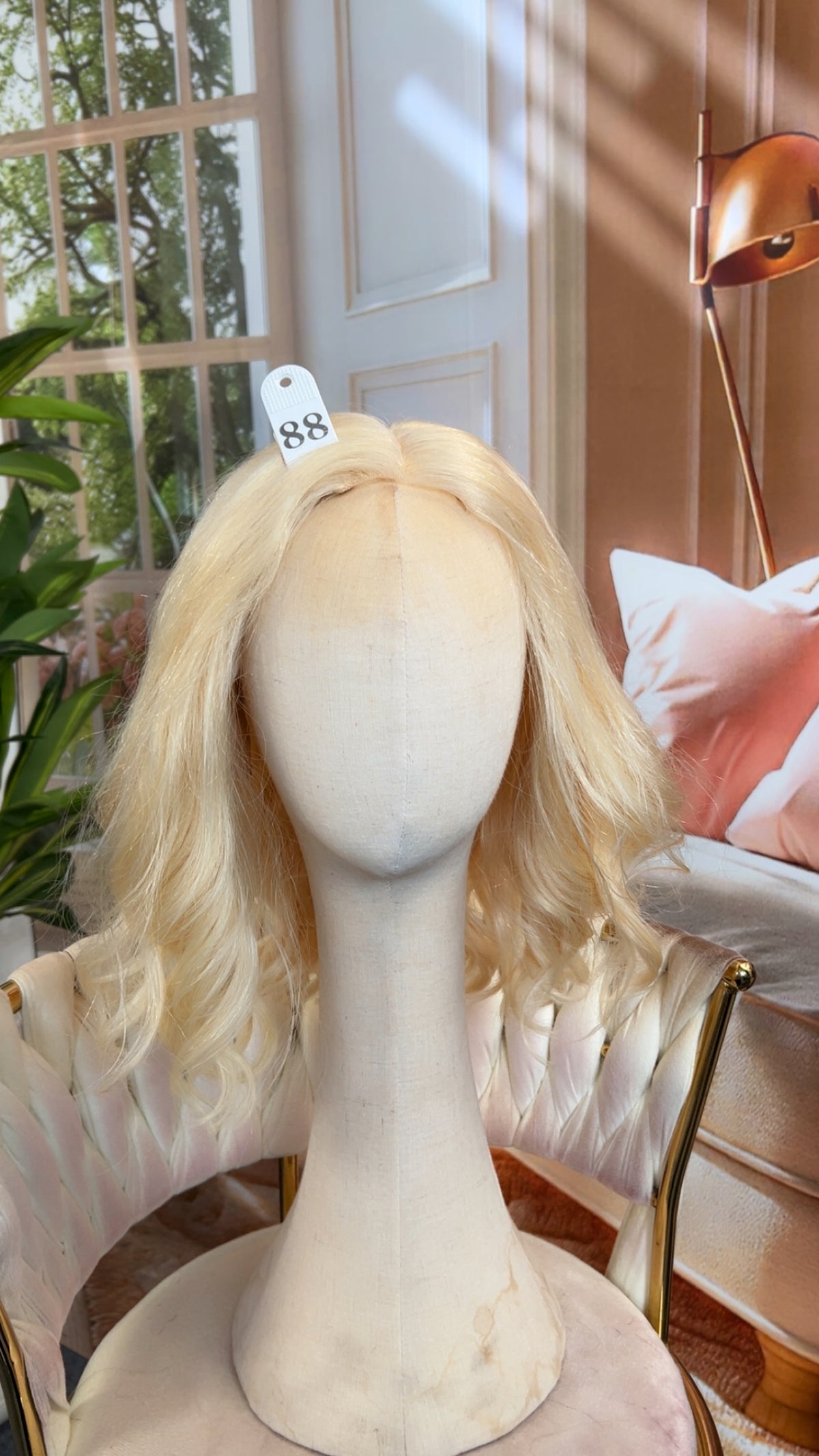 Luvme Hair live outlet wig with highlighted curls, styled with a natural part and layered look, showcasing a vibrant, textured wig.