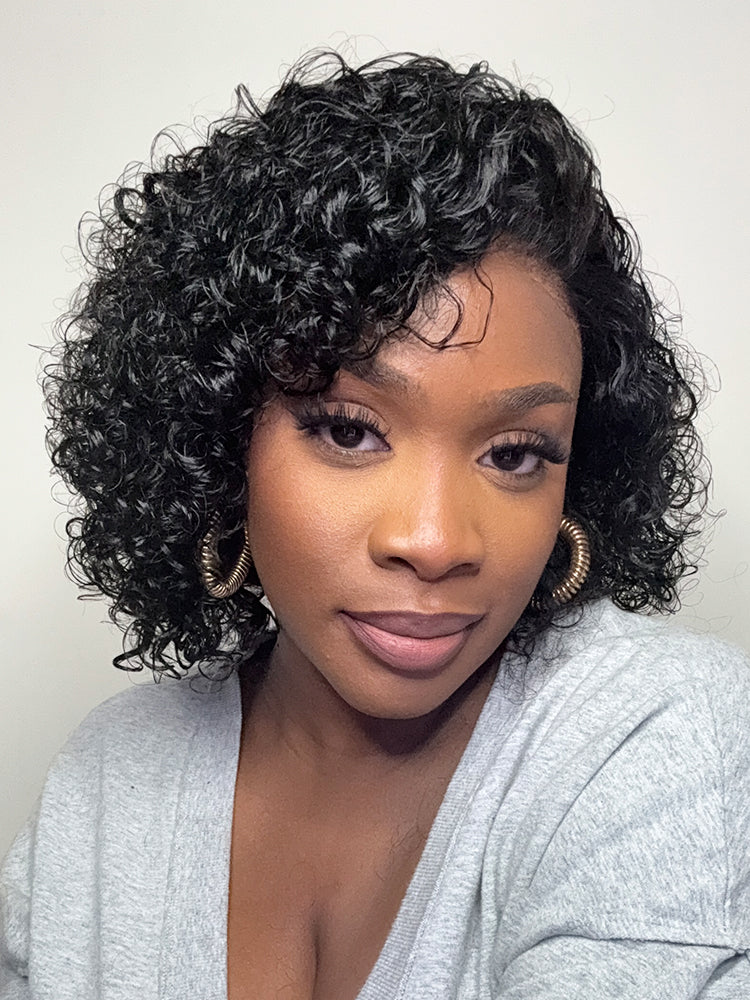 Luvme Hair ultra natural short curly wig with glueless ear-to-ear wide T lace front, slicked back style, and curly texture.