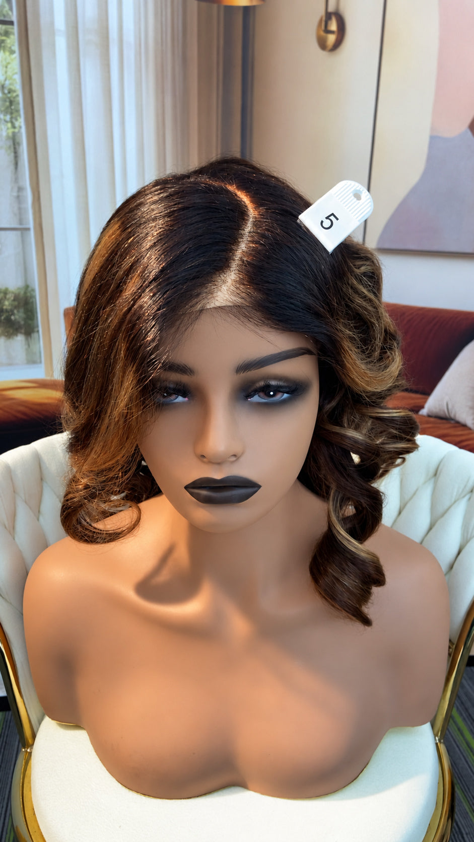 Luvme Hair live outlet wig displayed on a mannequin head, showcasing a natural straight hairstyle with dark brown color.