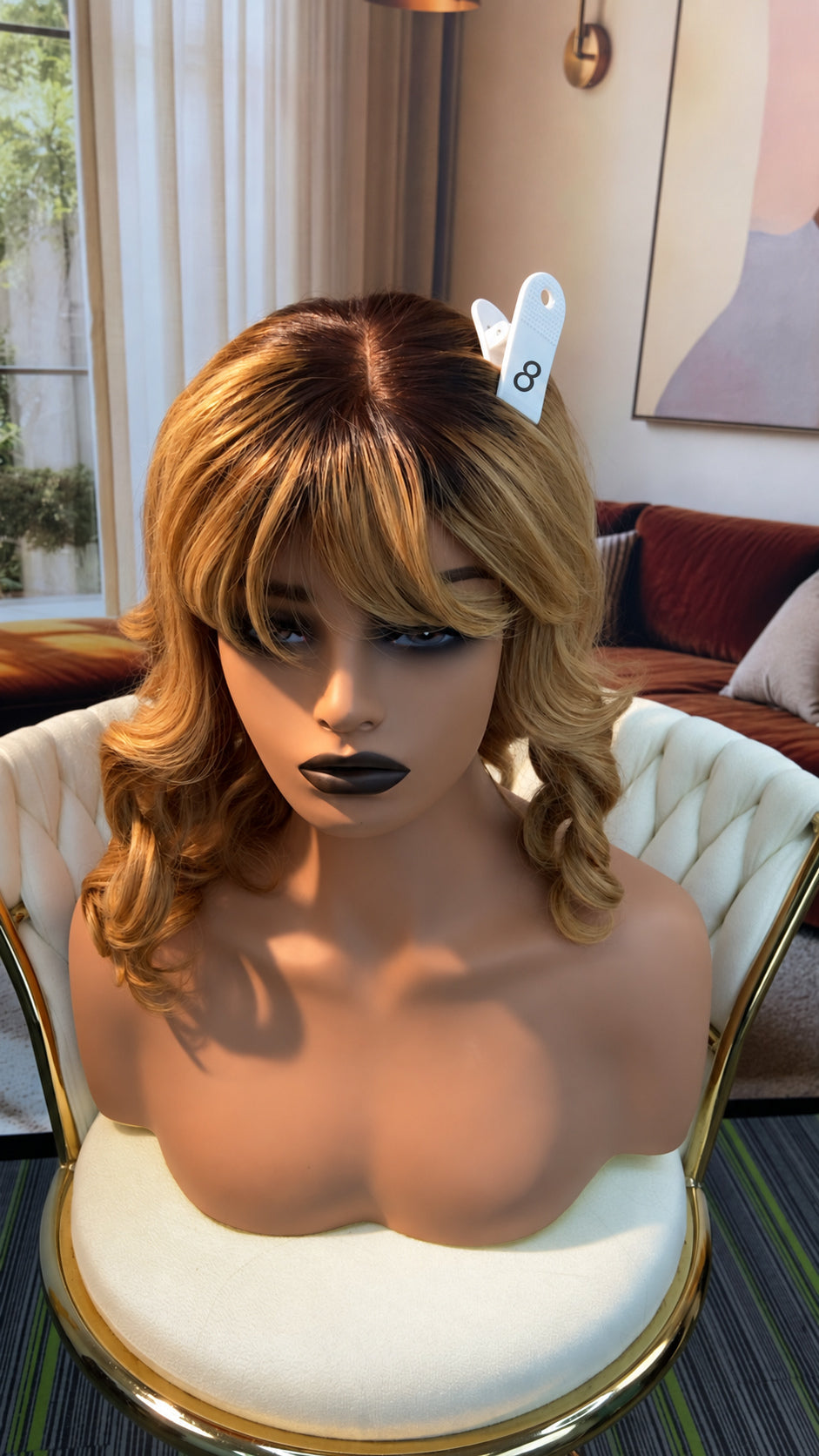 Luvme Hair live outlet wig displayed on a mannequin head, featuring a stylish, natural-looking wig with layered brown hair.