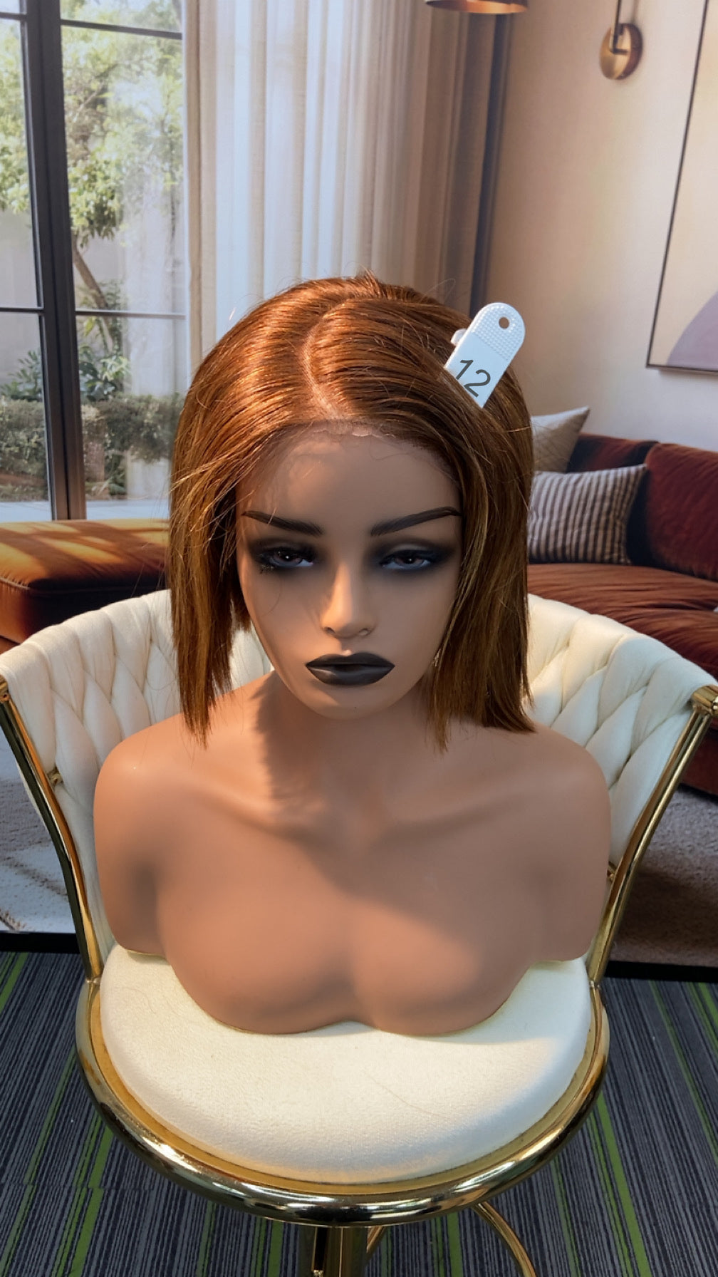 Luvme Hair live outlet wig displayed on a mannequin, showcasing its natural black color and layered style.