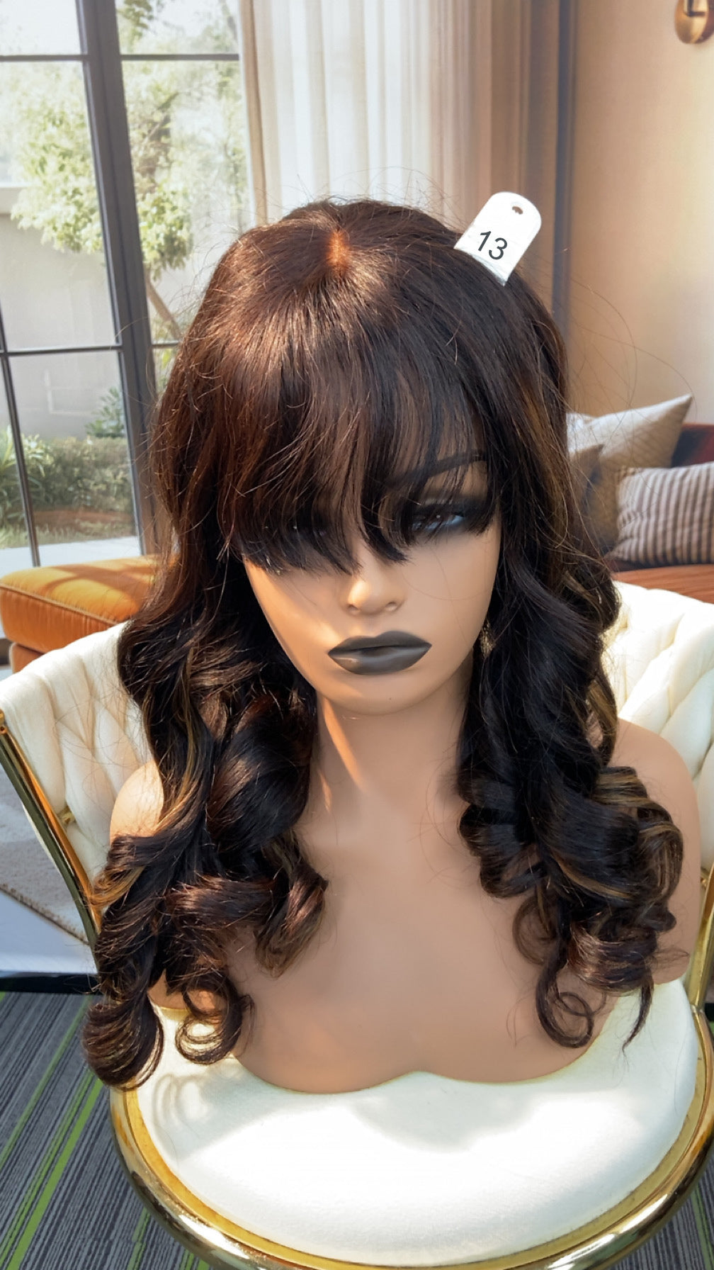 Luvme Hair outlet wig with natural black straight hair, styled in a shoulder-length cut, displayed on a mannequin head.