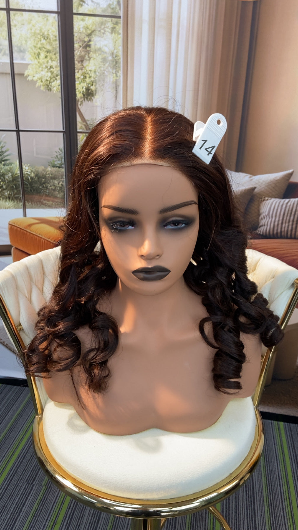 Luvme Hair live outlet wig in natural black, styled with loose waves, featuring a full lace cap and shoulder-length cut.