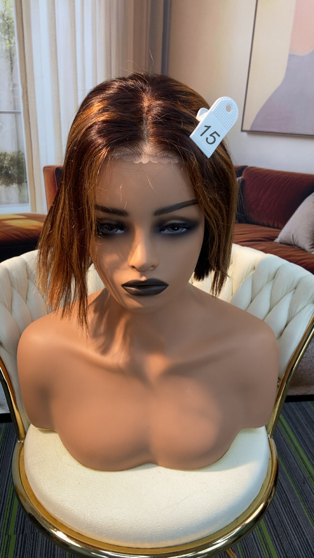 Luvme Hair live outlet wig displayed on a mannequin, showcasing a stylish, natural-looking synthetic wig with layered bangs.