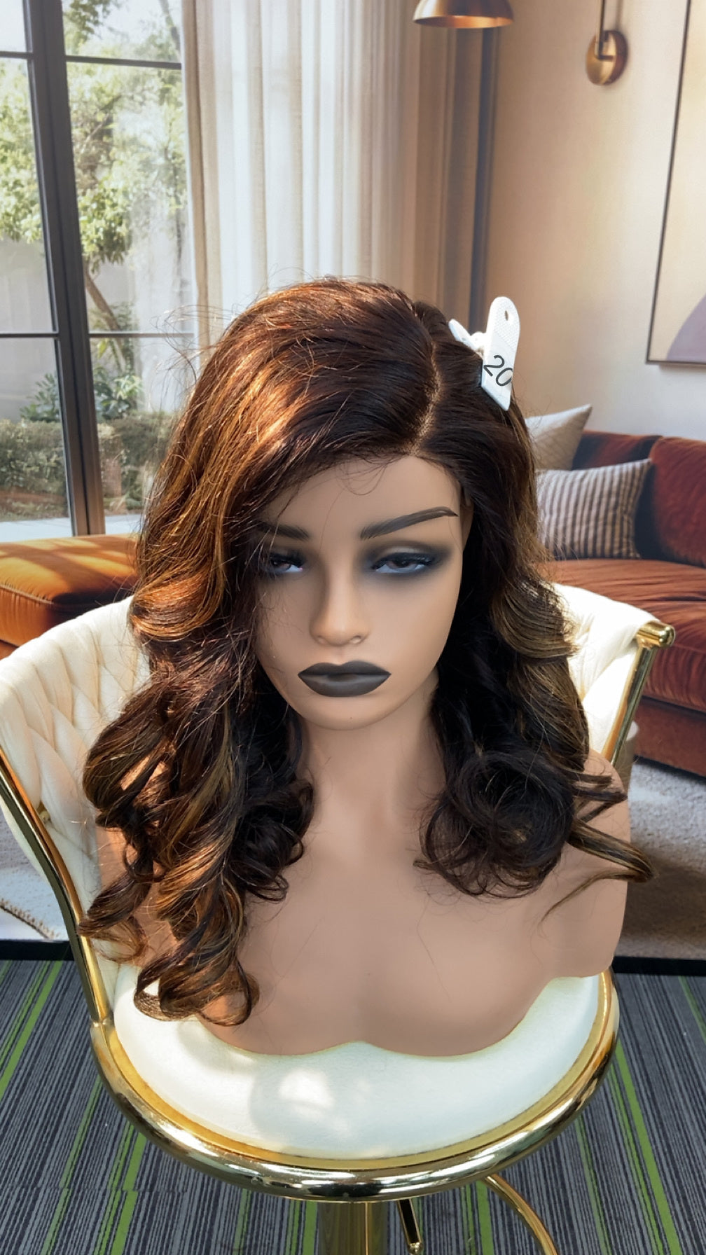 Luvme Hair live outlet wig displayed on a mannequin, showcasing a stylish hairstyle with natural waves and a full lace cap.