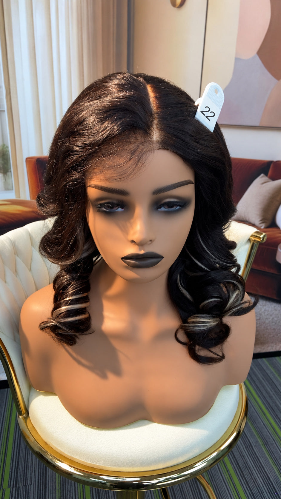 Luvme Hair live outlet wig displayed on a mannequin, showcasing the style with natural hair texture and color.