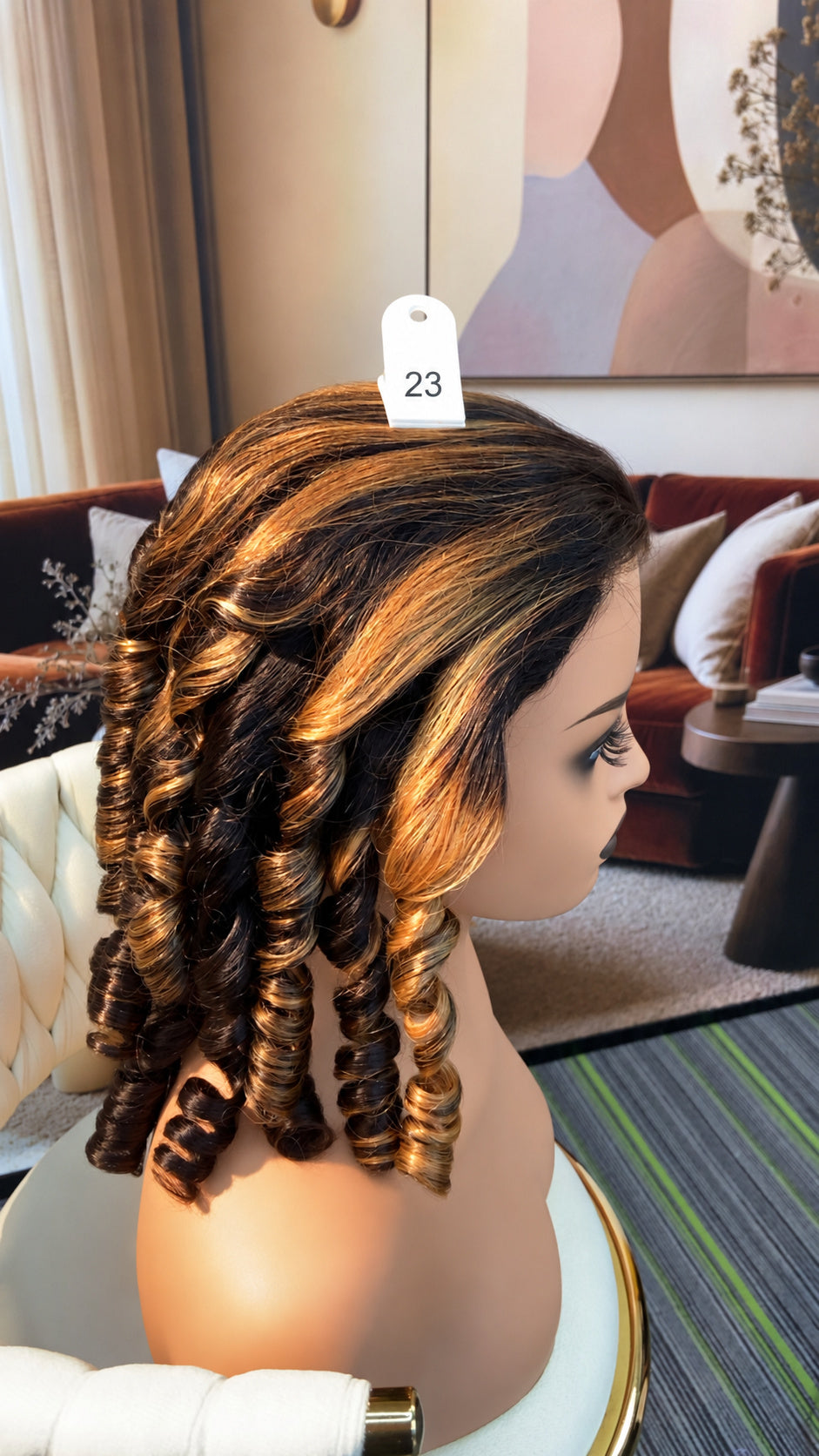 Luvme Hair live outlet wig displayed on a mannequin head, showcasing the style and texture of the synthetic wig.