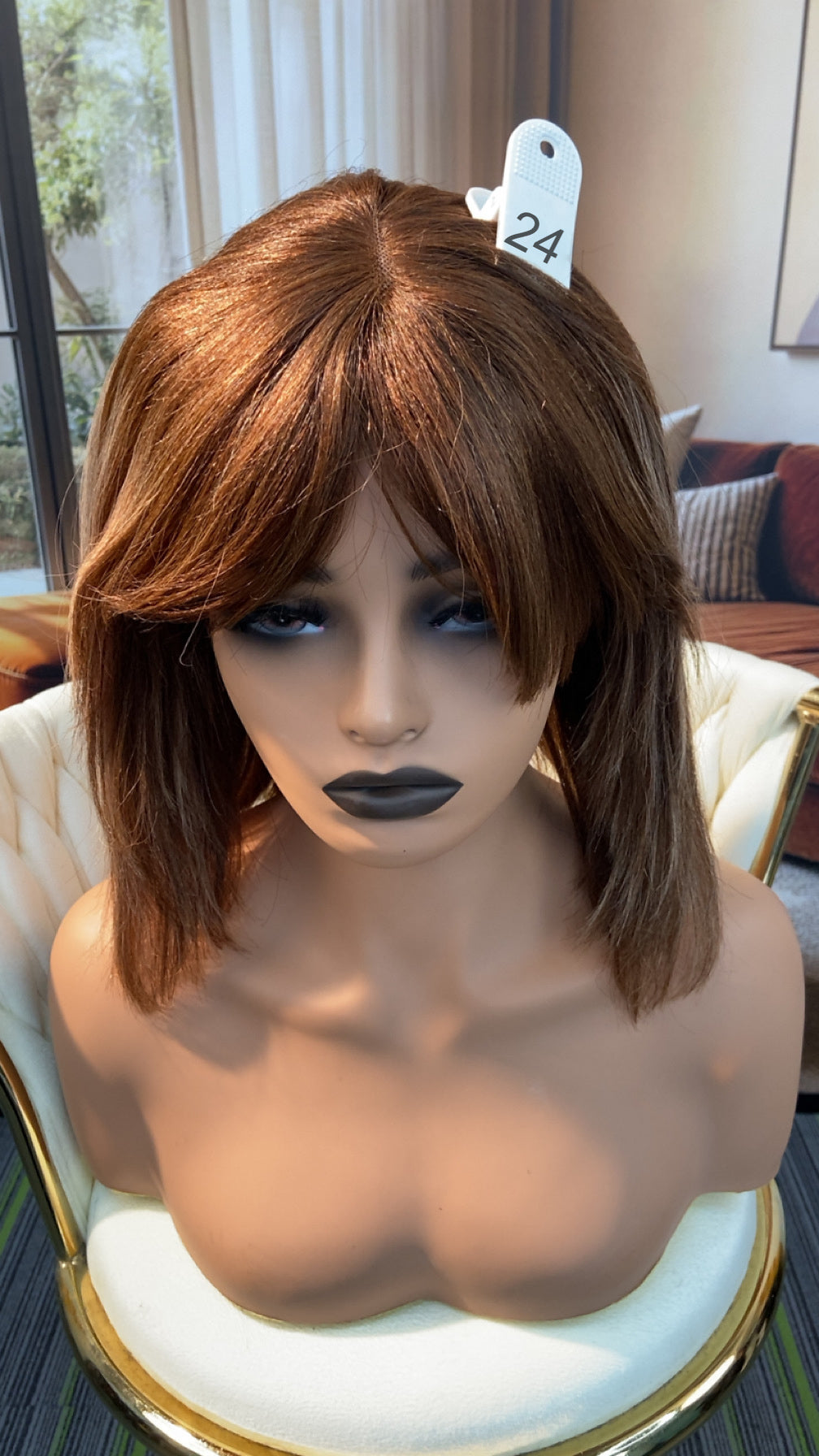 Luvme Hair live outlet wig on display, showcasing a stylish wig style with natural curls and vibrant color.