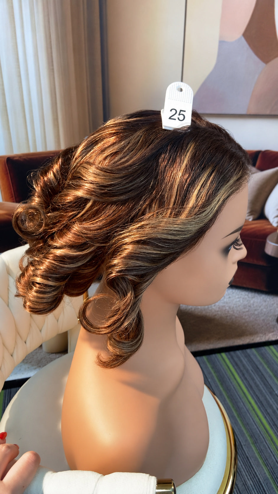 Luvme Hair live outlet wig displayed on a mannequin head, showcasing a stylish, natural-looking wig style with dark roots and soft waves.