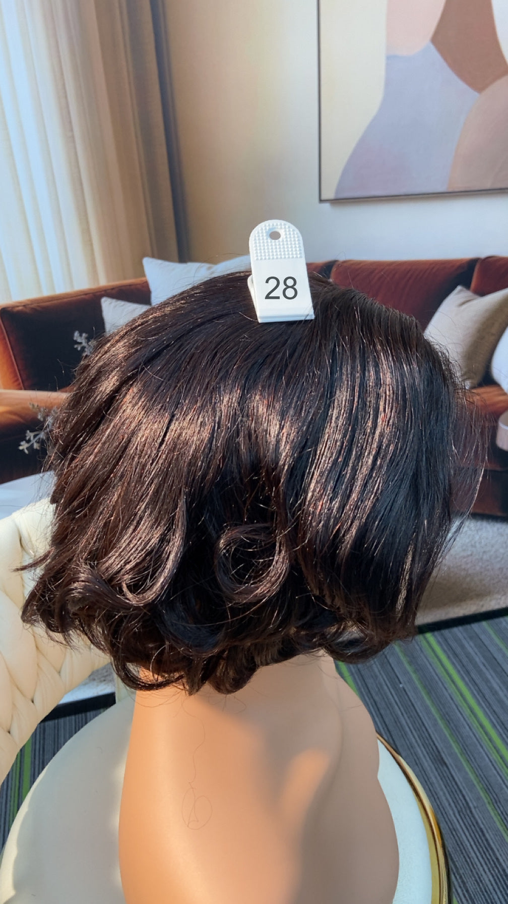 Luvme Hair live outlet wig displayed on a mannequin head, showcasing the style and color of the 50% off wig offer.