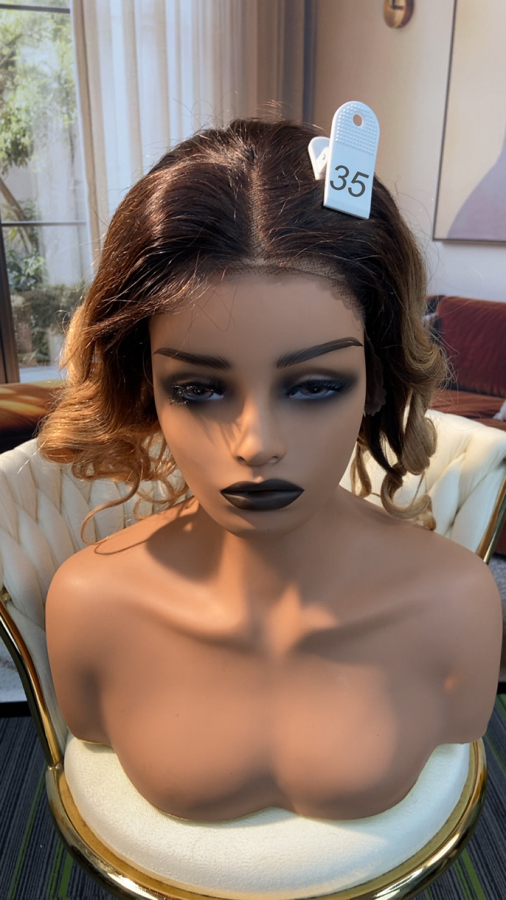 Luvme Hair live outlet wig display featuring various styles, showcasing different wig textures and lengths on mannequins.