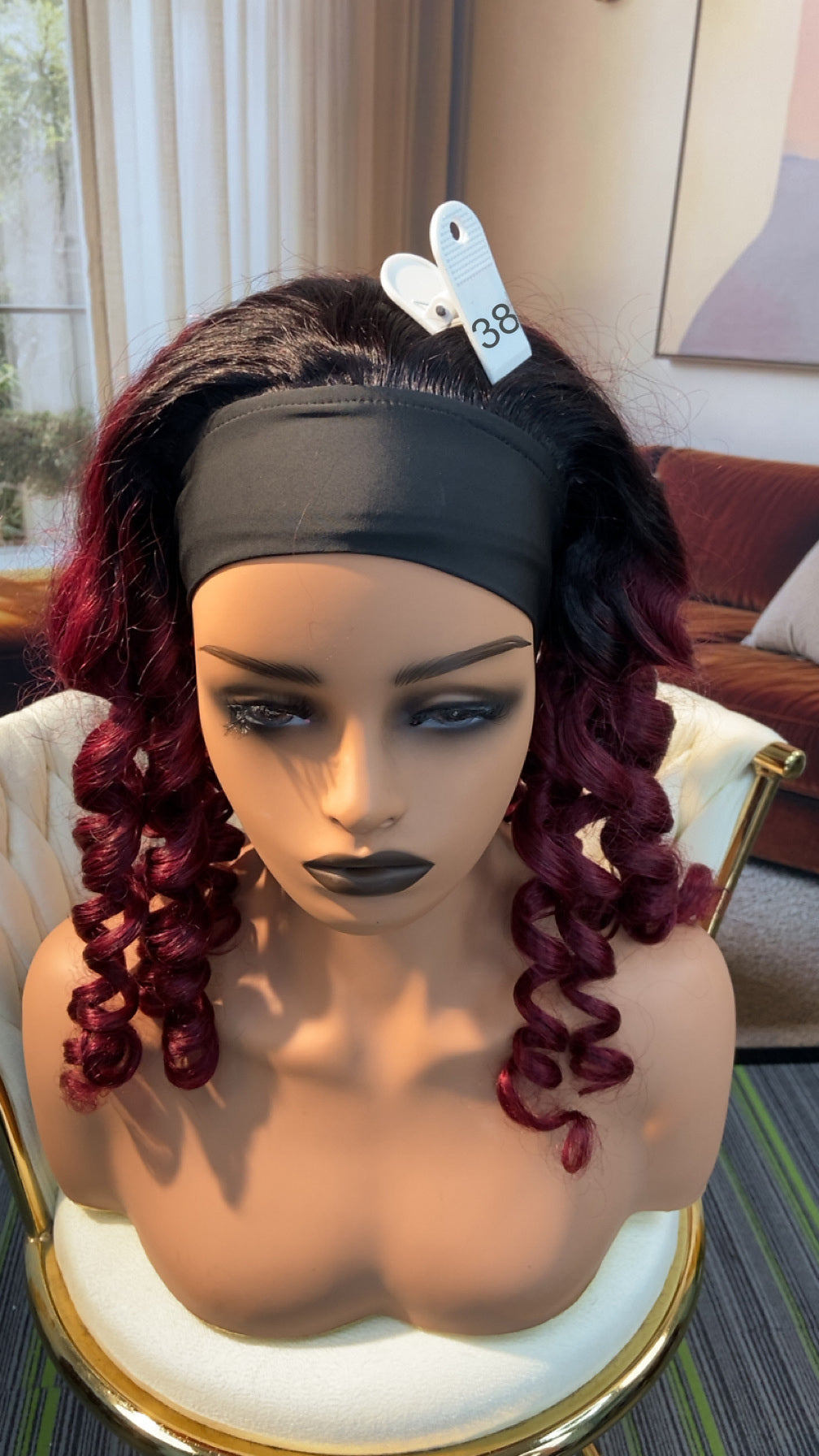 Luvme Hair live outlet wig displayed in natural style, with 50% off offer, featuring layered brown wig on a mannequin head.