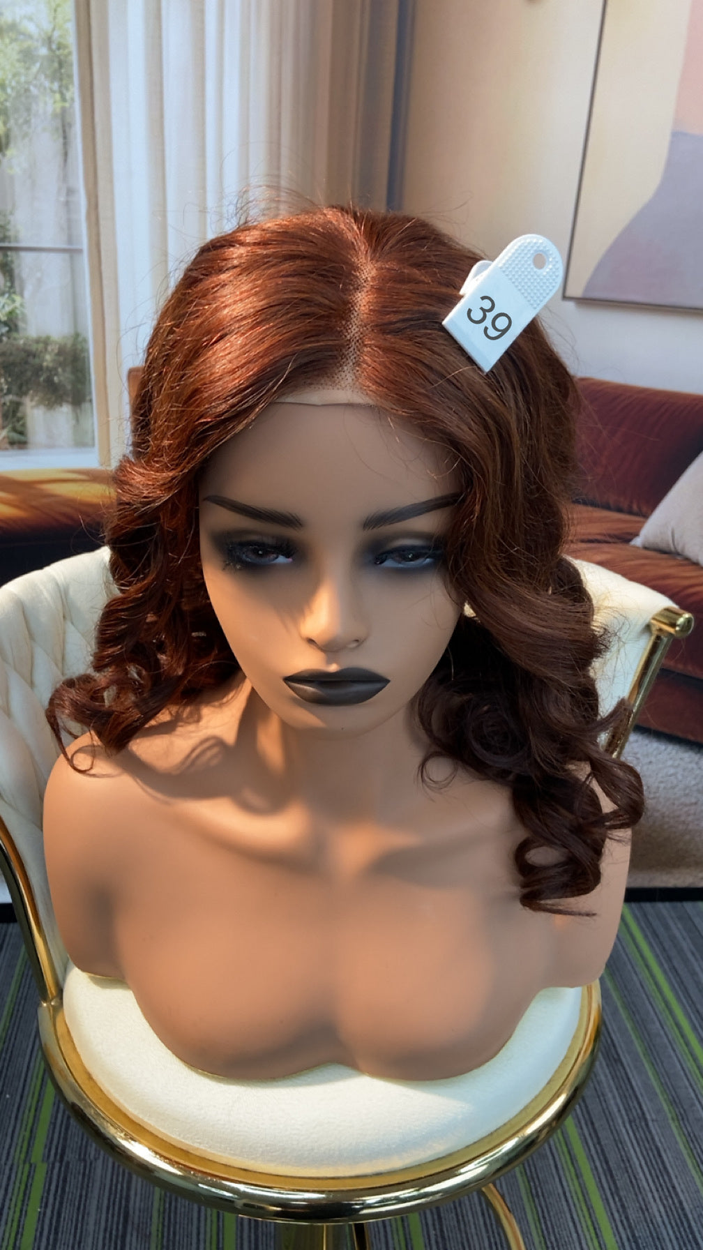 Luvme Hair live outlet wig displayed on a mannequin, showcasing the style and texture of the synthetic or human hair wig.