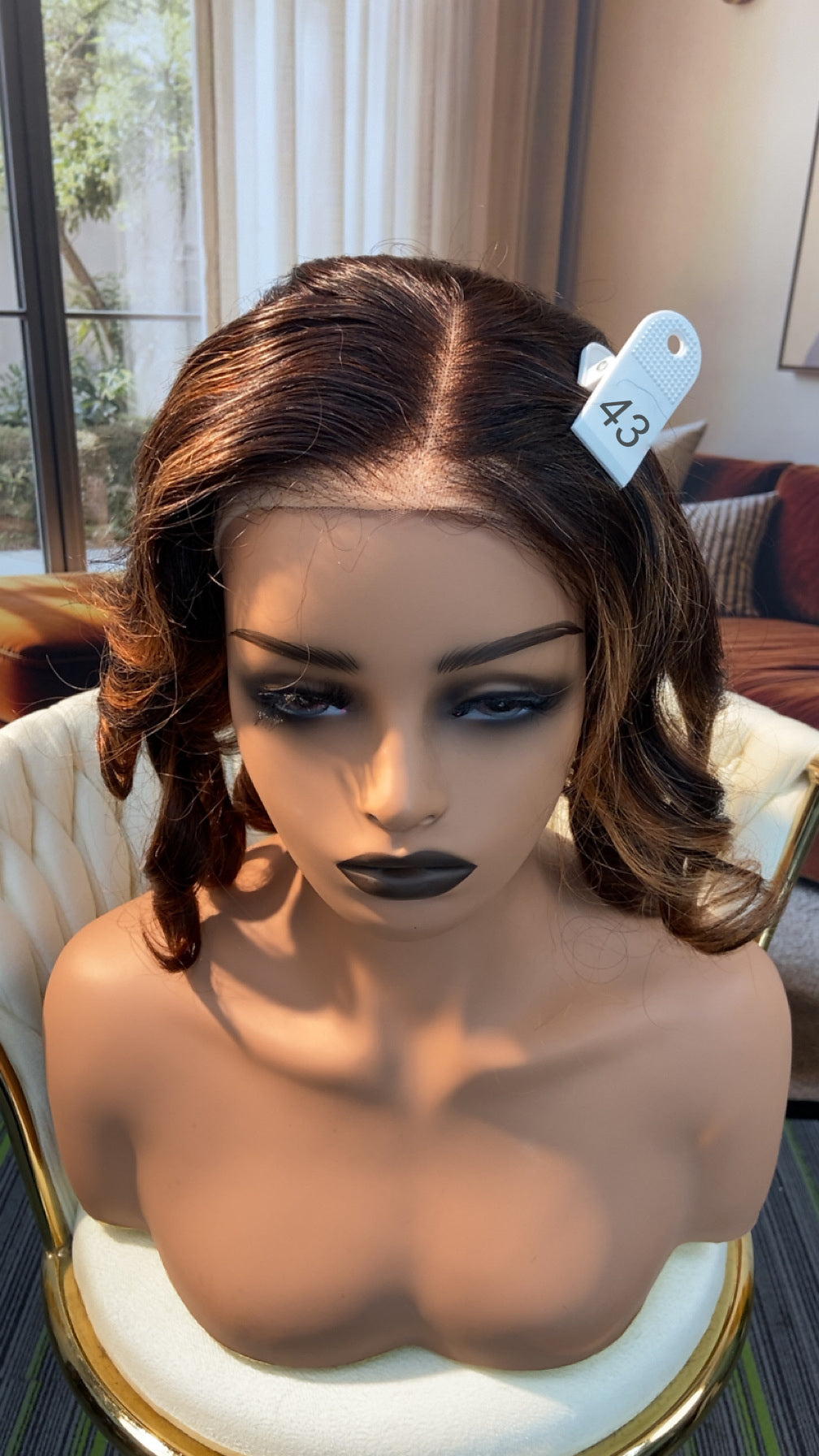 Luvme Hair live outlet wig in natural black, showcasing the full wig style and texture on a mannequin head.