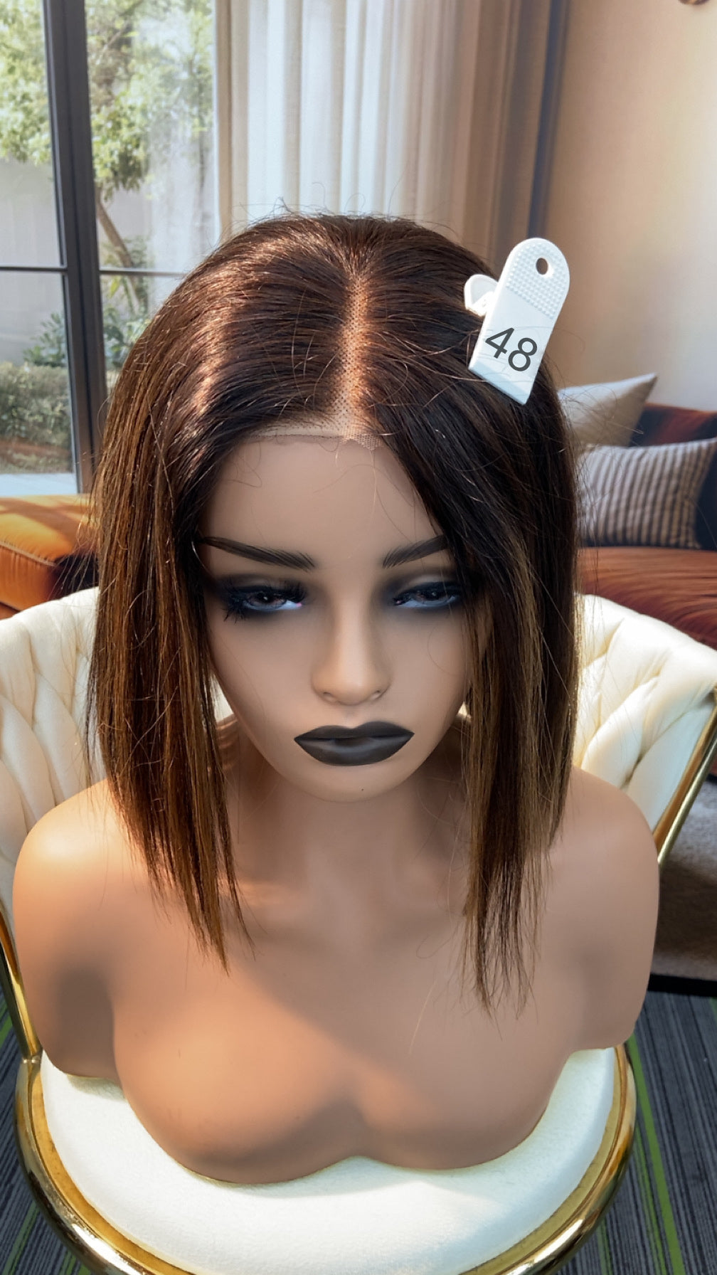 Luvme Hair live outlet wig in various styles on display, showcasing different textures and colors available at 50% off.