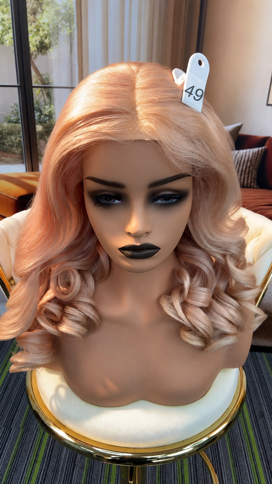 Luvme Hair live outlet wig displayed on a mannequin, featuring its style and color for a natural, full look.