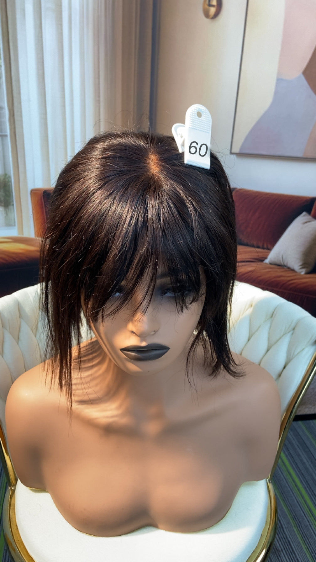 Luvme Hair outlet wig in natural black, showcasing layered style with soft curls, perfect for a stylish everyday look.