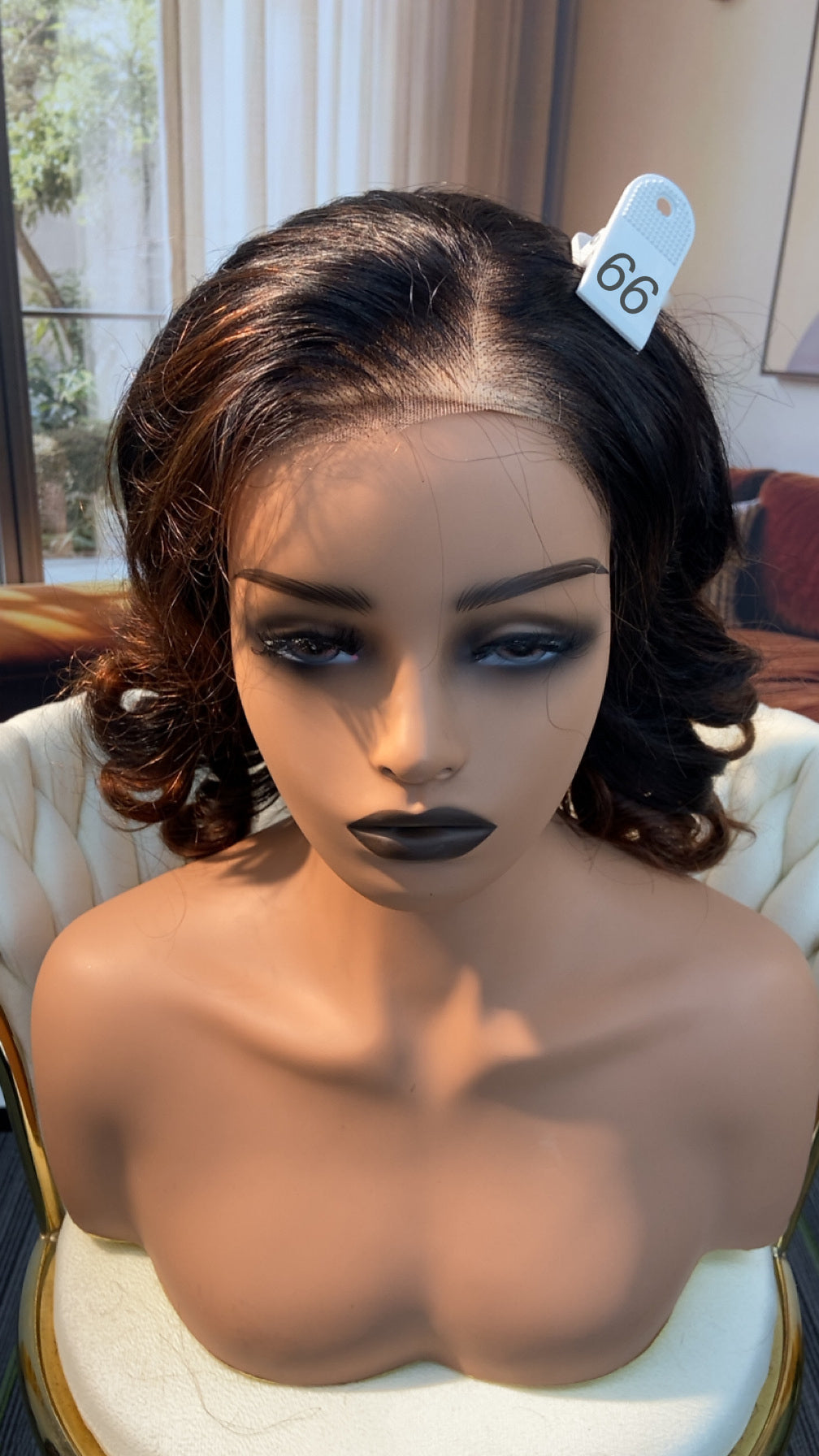 Luvme Hair live outlet wig displayed on a mannequin, showcasing a stylish, full lace wig with natural hair color and texture.