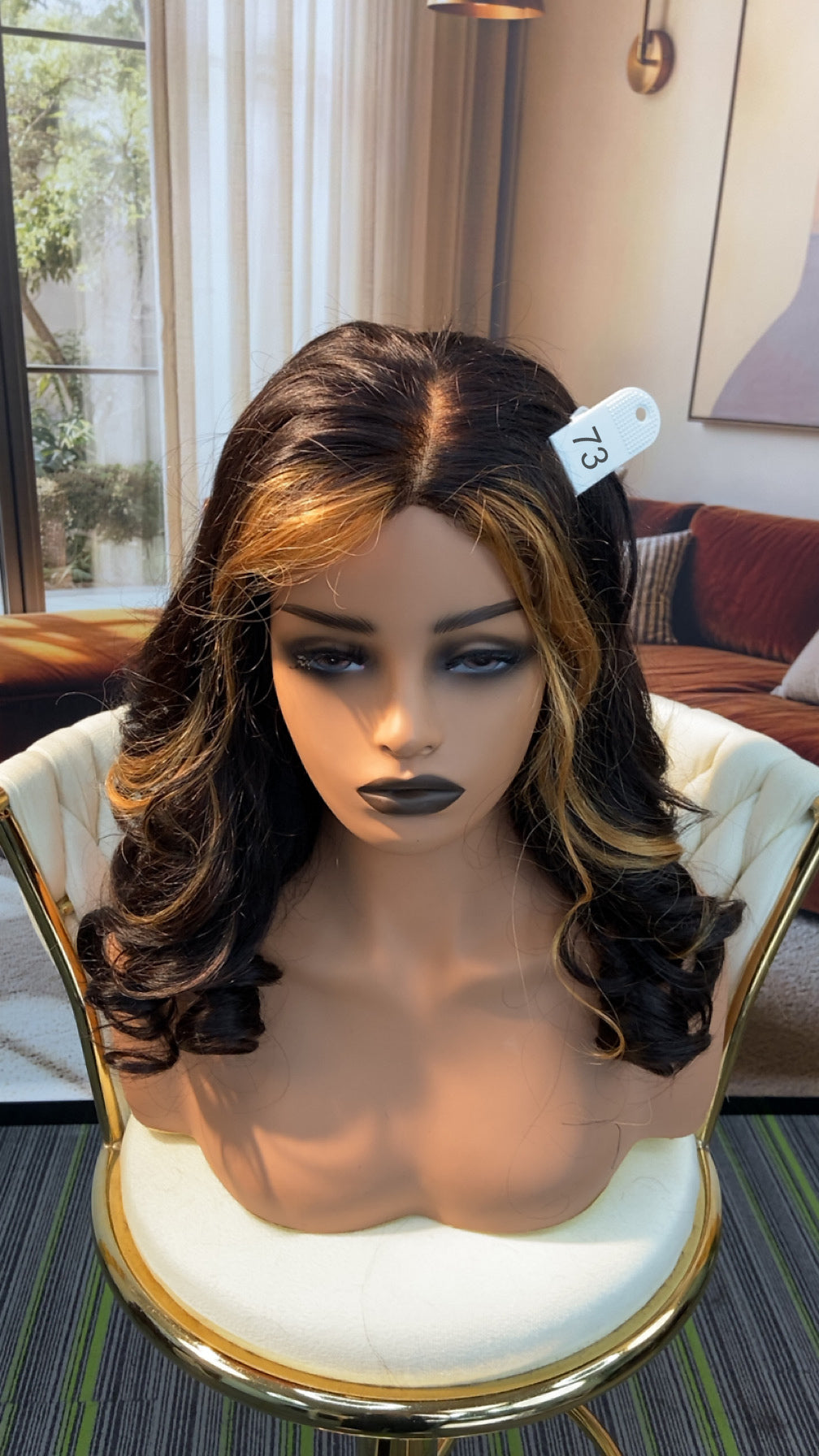 Luvme Hair outlet wig displayed in natural black, styled with loose waves, highlighting the 50% off live outlet wig offer.